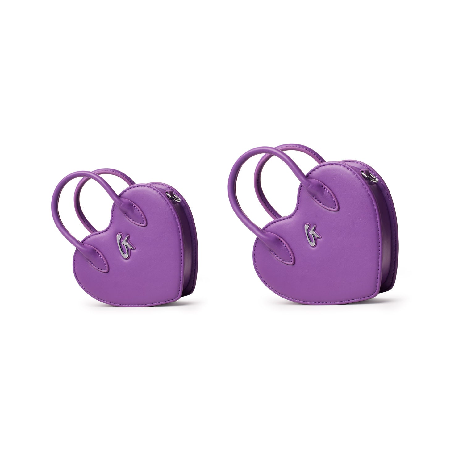 Two purple heart-shaped bags with handles, featuring a small logo on the front, shown in different sizes against a white background.