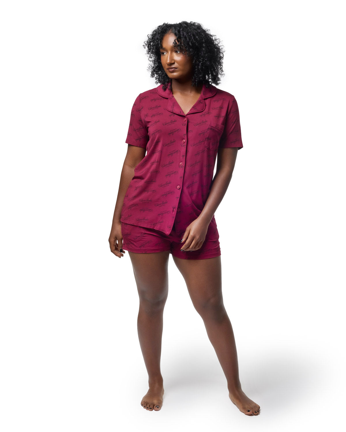 Burgundy pajama short set featuring a button-up shirt and matching shorts, designed for stylish comfort.