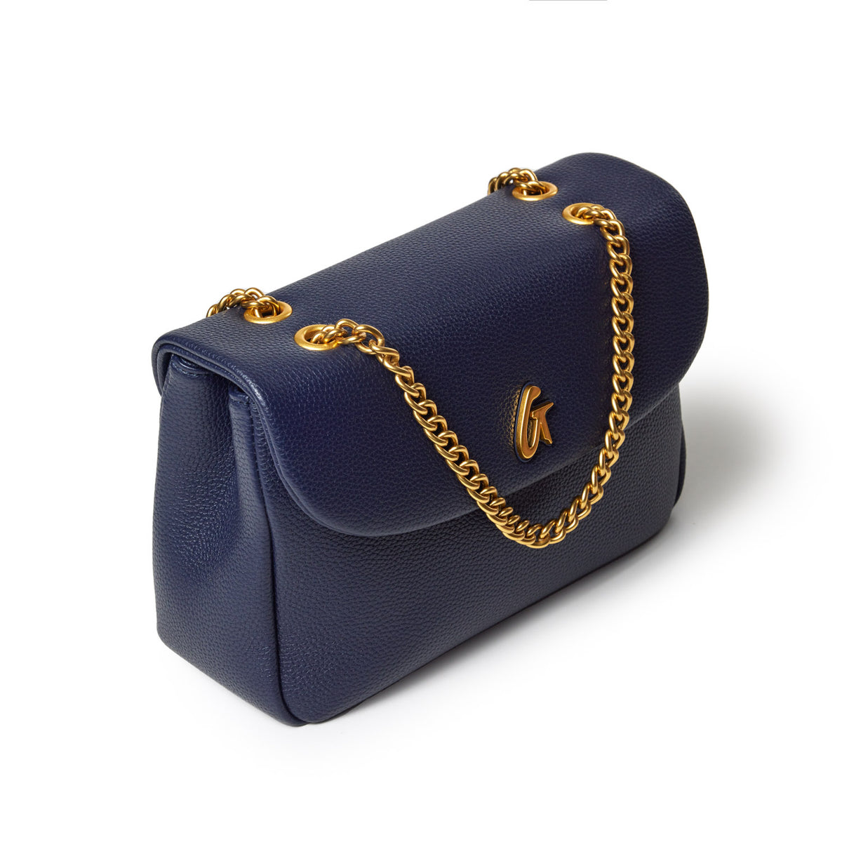 Medium navy pebble leather flap bag with gold chain strap and logo detail, stylish and compact for everyday use.