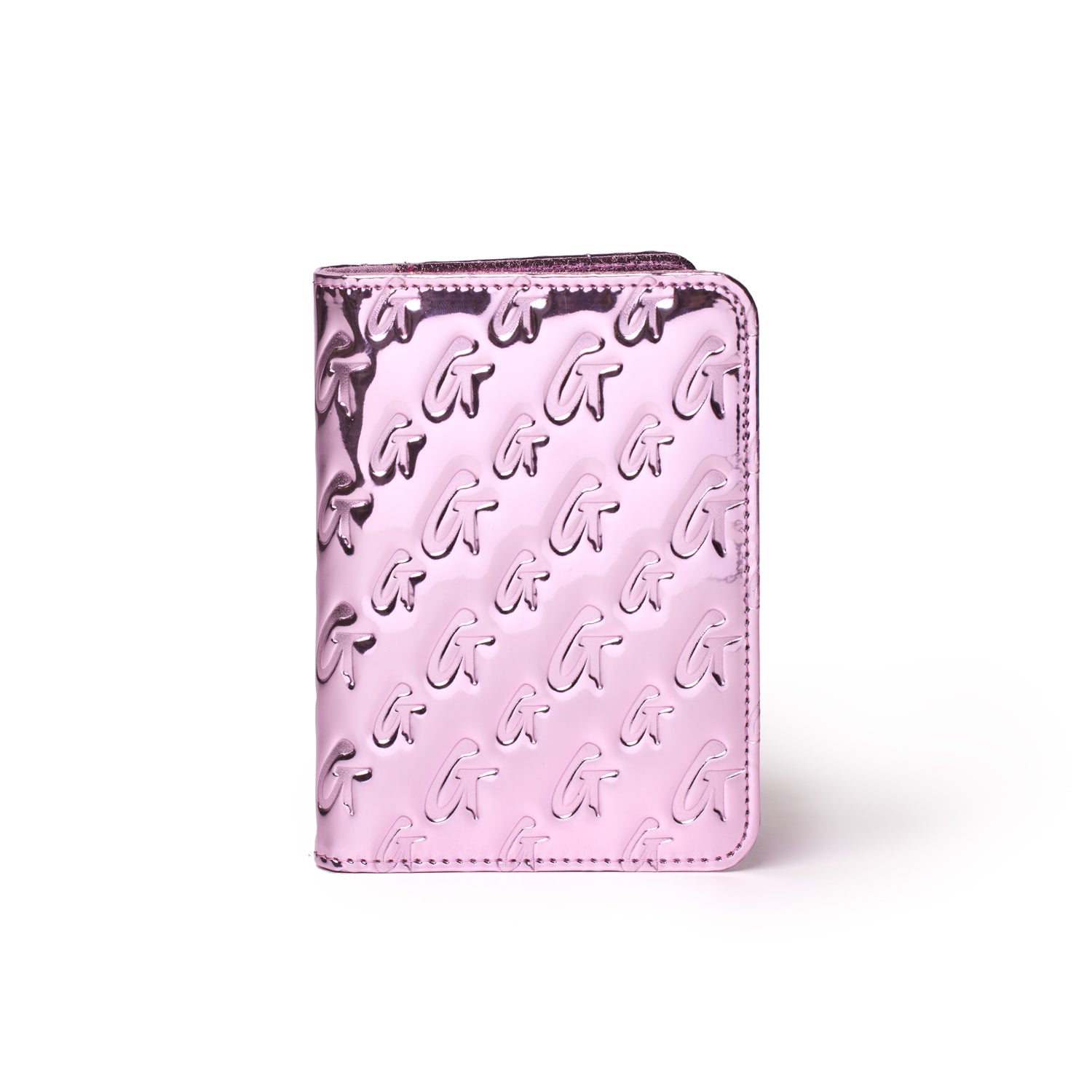 Metallic pink passport holder with embossed monogram pattern and a shiny, reflective finish.