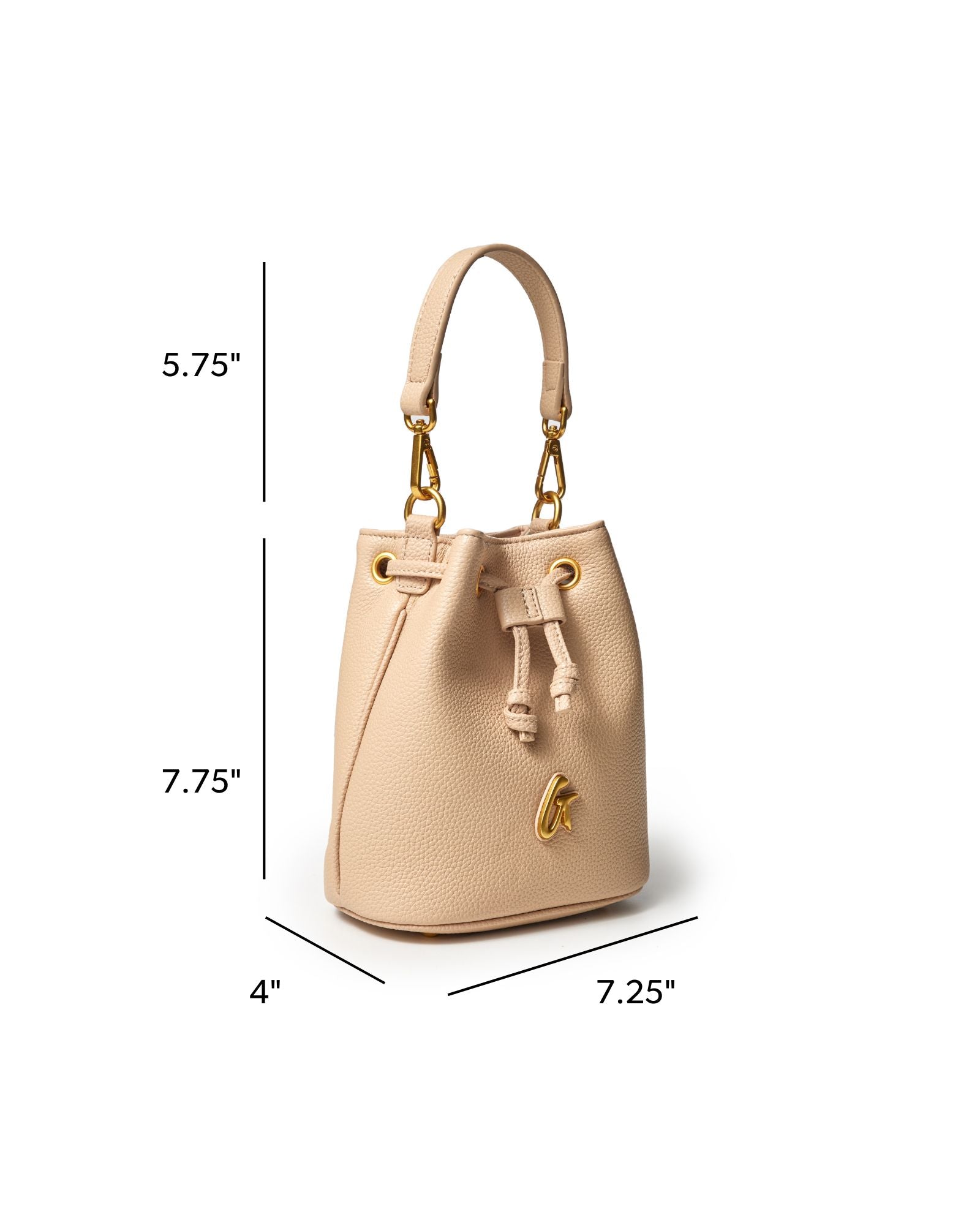 Nude mini pebble bucket bag with gold accents, featuring a drawstring closure and a stylish handle.