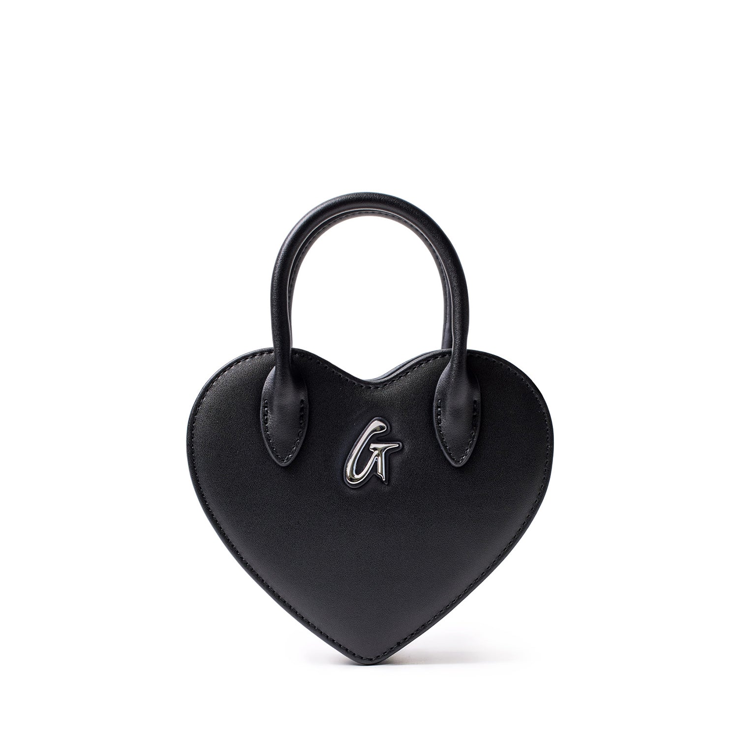 Small black heart-shaped bag with a top handle and silver "G" logo on the front, made of smooth faux leather.