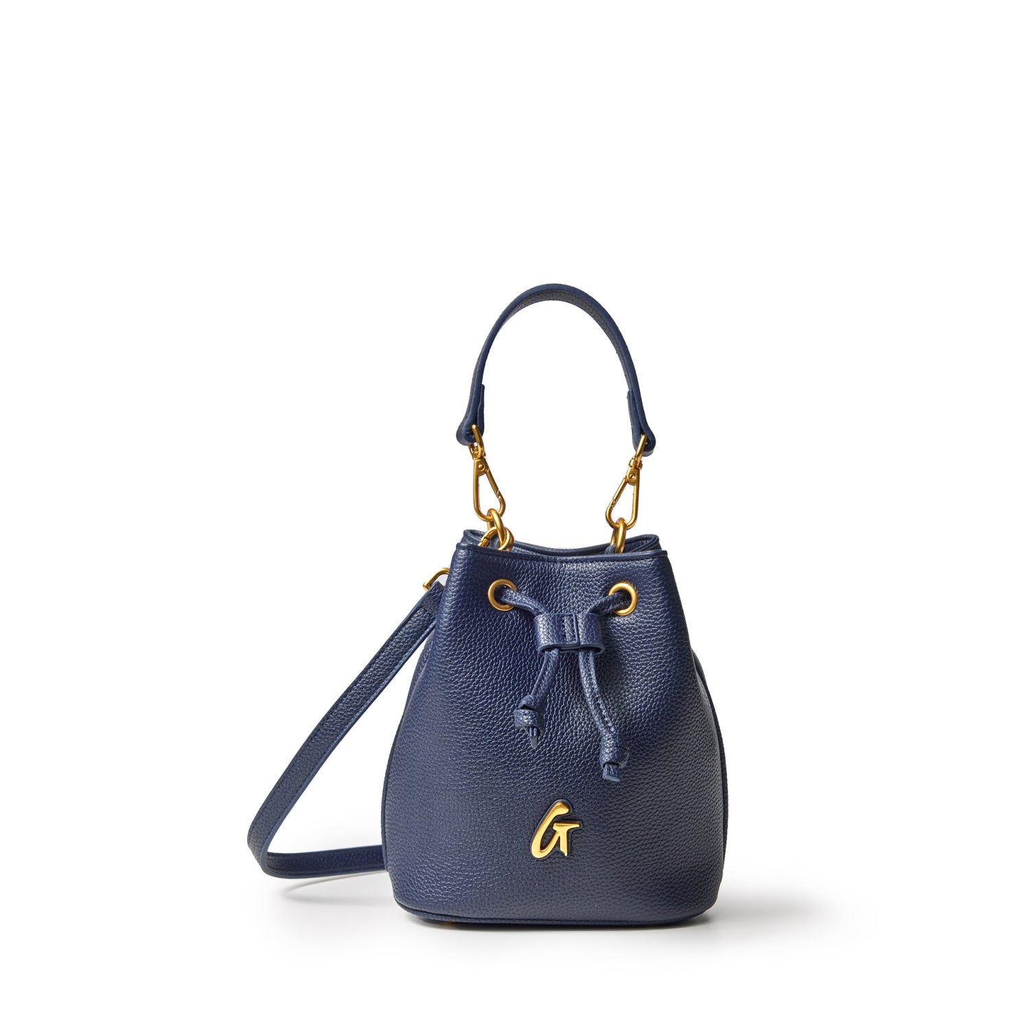 Mini pebble bucket bag in navy with gold hardware, drawstring closure, top handle, and adjustable shoulder strap.