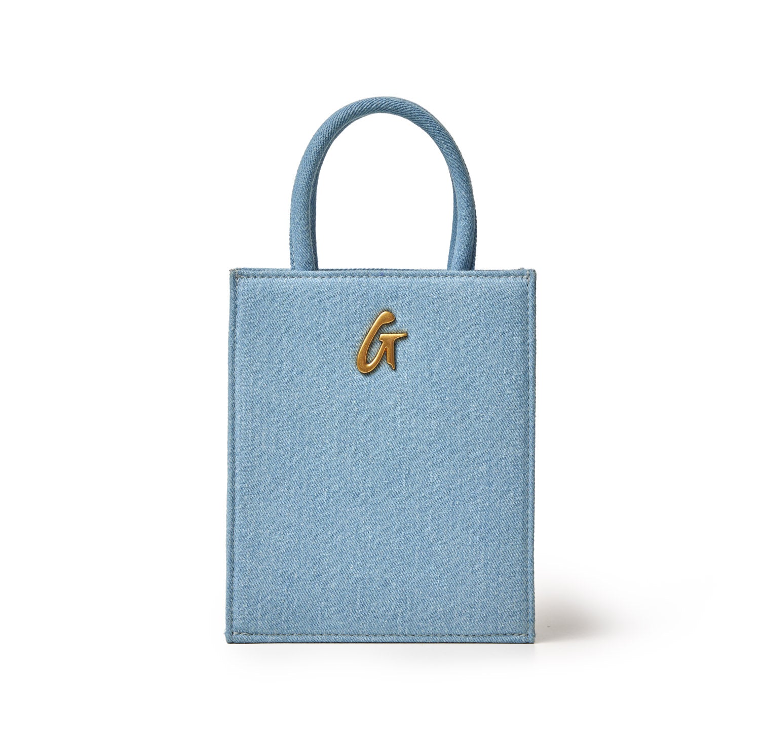 Mini denim tote bag with gold-tone "G" logo, featuring a small, structured design and short denim handles.