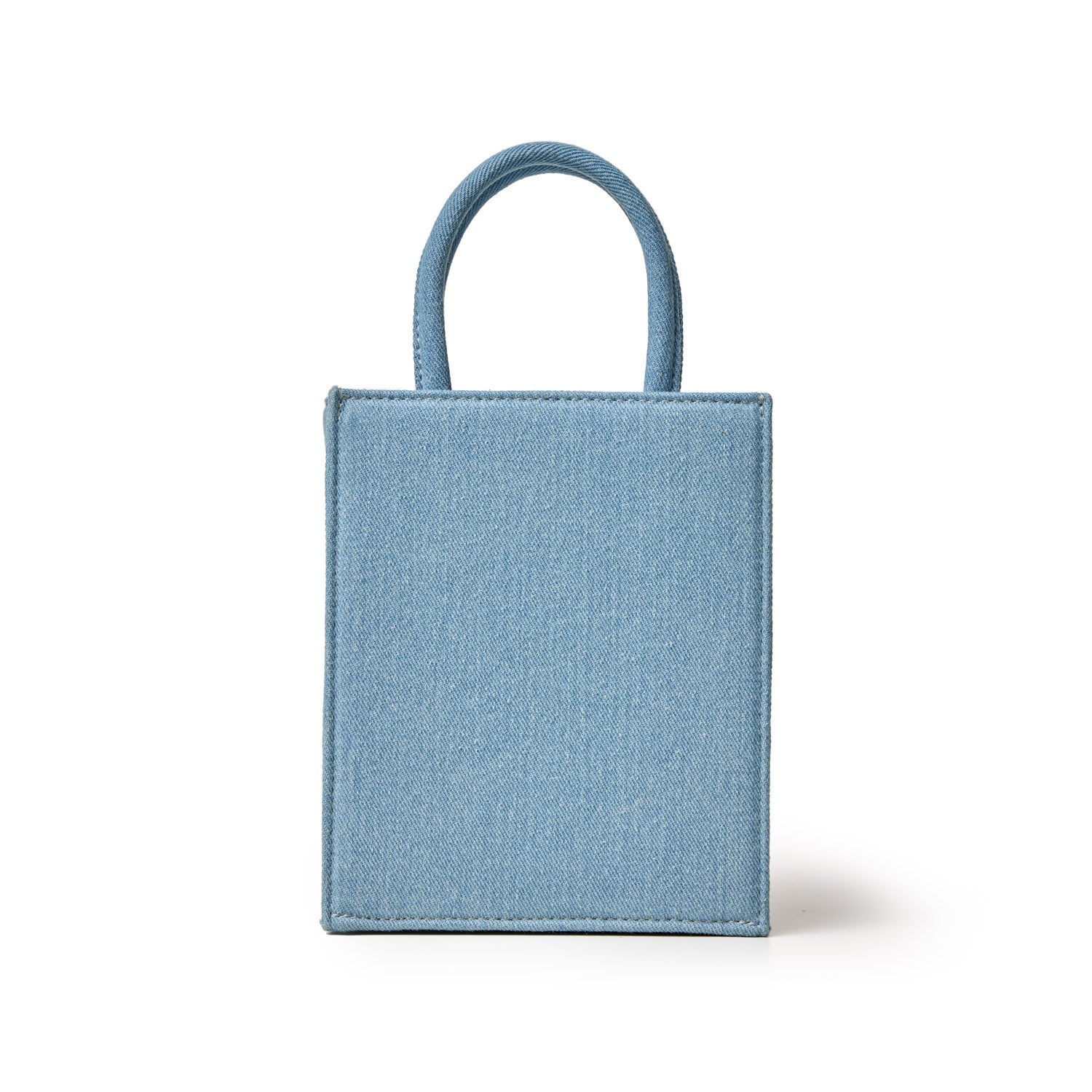 Mini denim tote bag with gold accents, featuring a rectangular shape and small rounded handles on top.