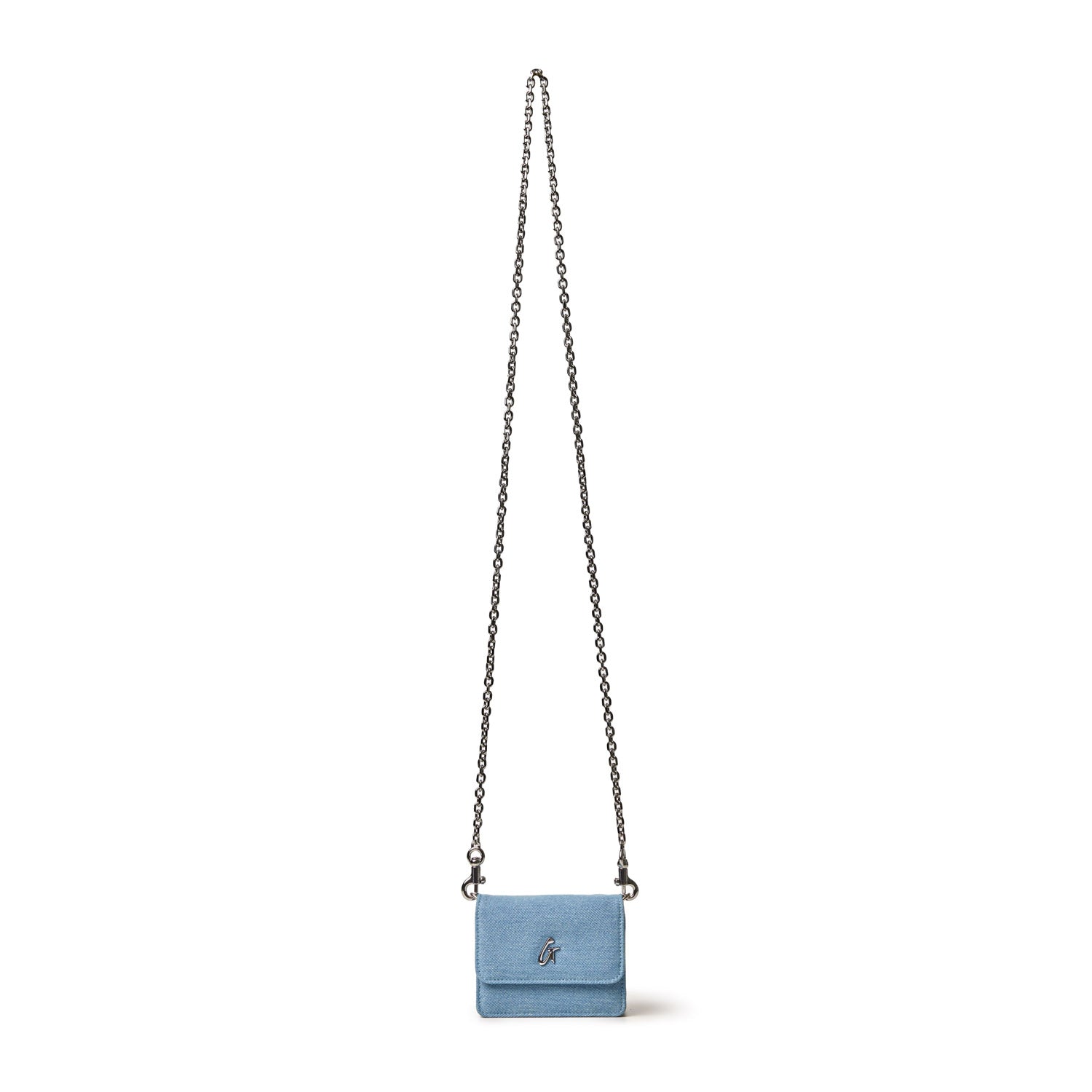 Mini denim silver WOC handbag with a chain strap, featuring a small flap and a silver logo on the front.