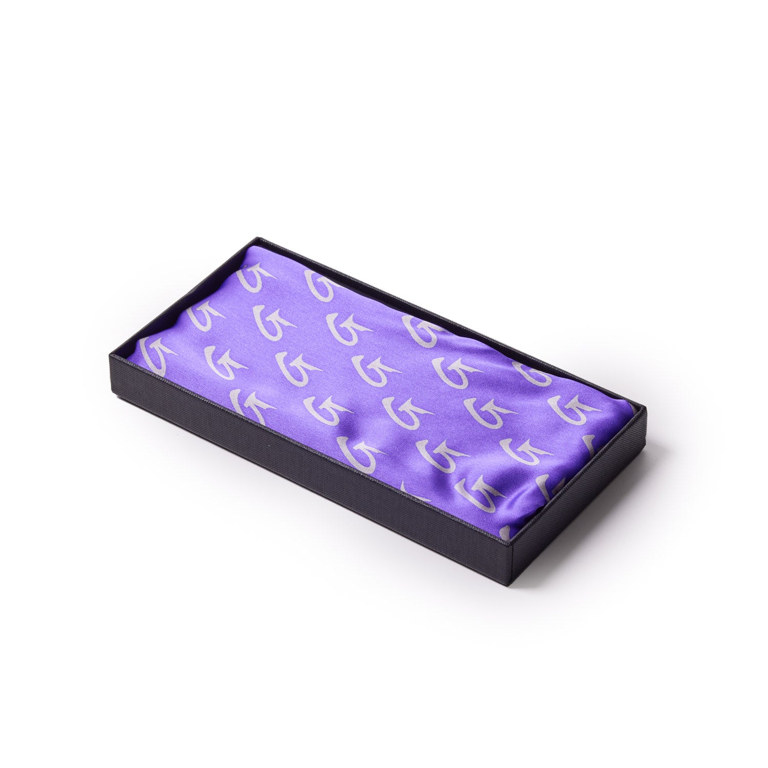 Medium purple silk scarf with a monogram pattern, displayed in a black presentation box.