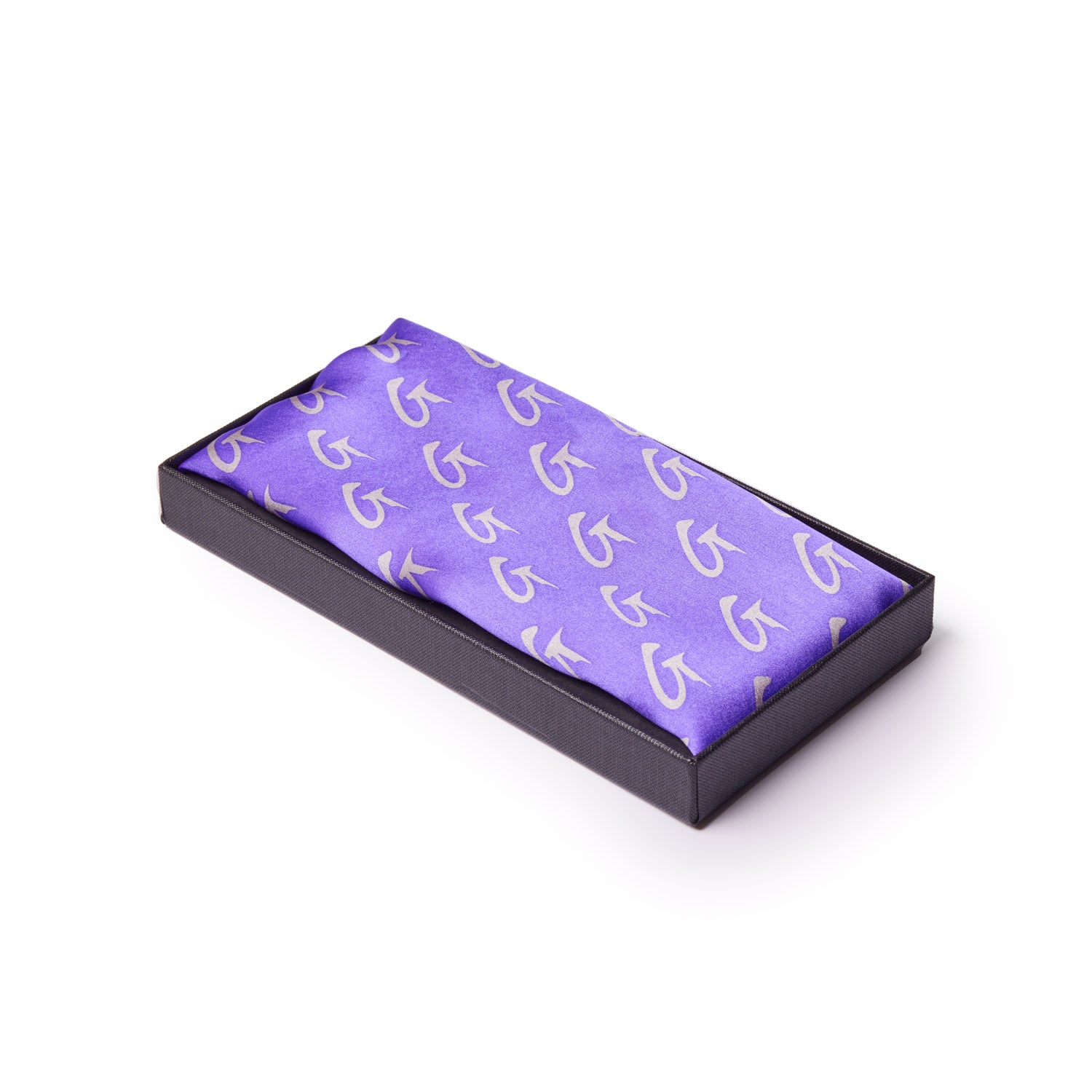 Purple silk scarf with large monogram pattern, neatly folded in a black presentation box.
