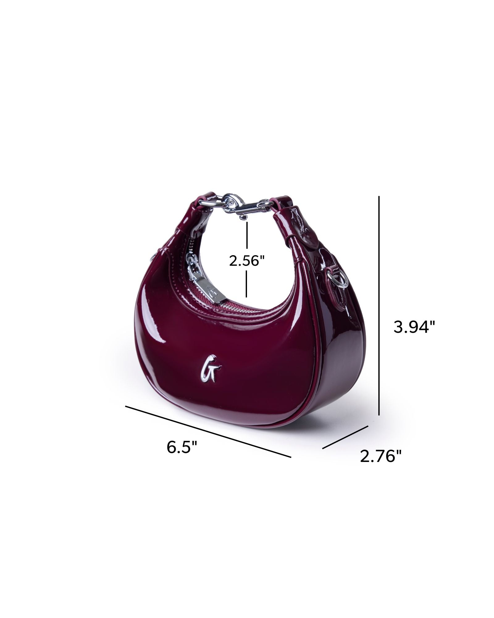 Glossy burgundy hobo bag with a sleek design, featuring a curved silhouette and silver hardware accents.