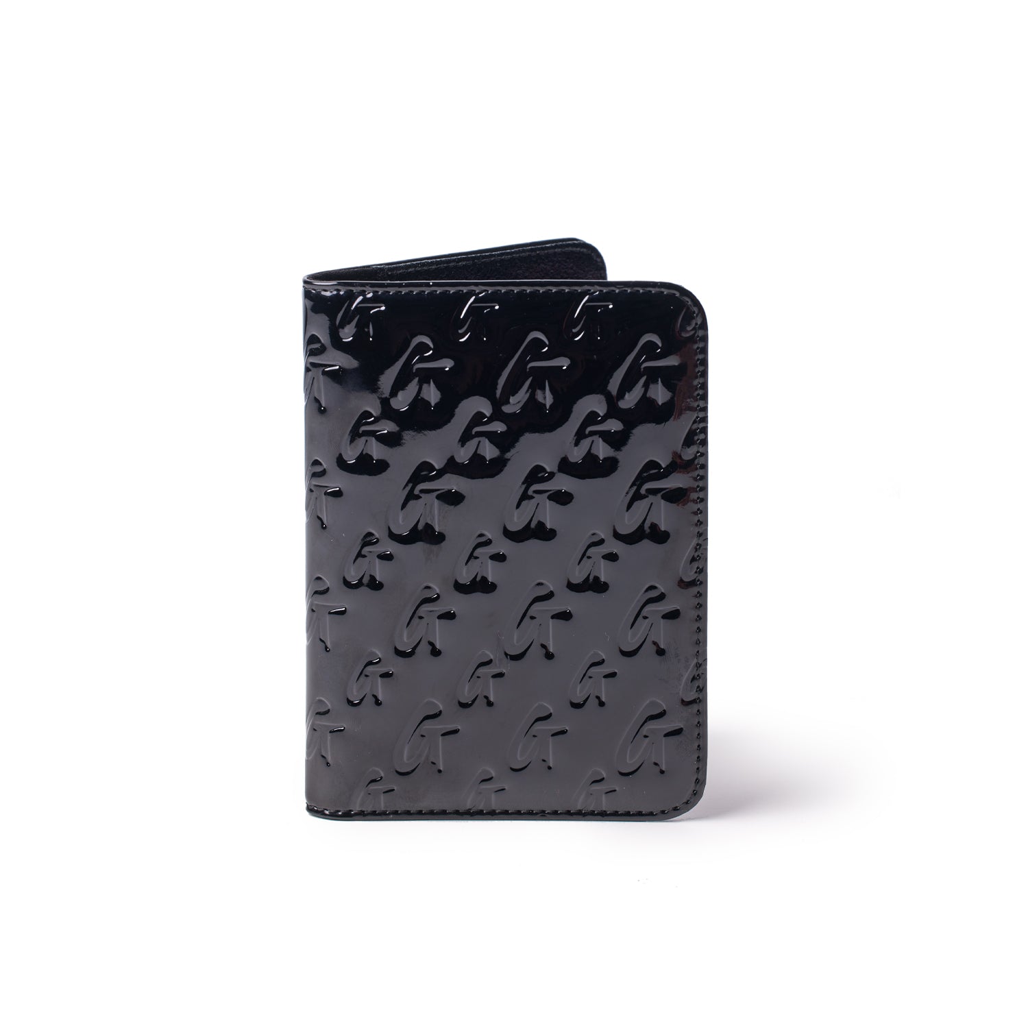 Black mirror finish passport holder with embossed monogram pattern, designed for stylish travel accessories.