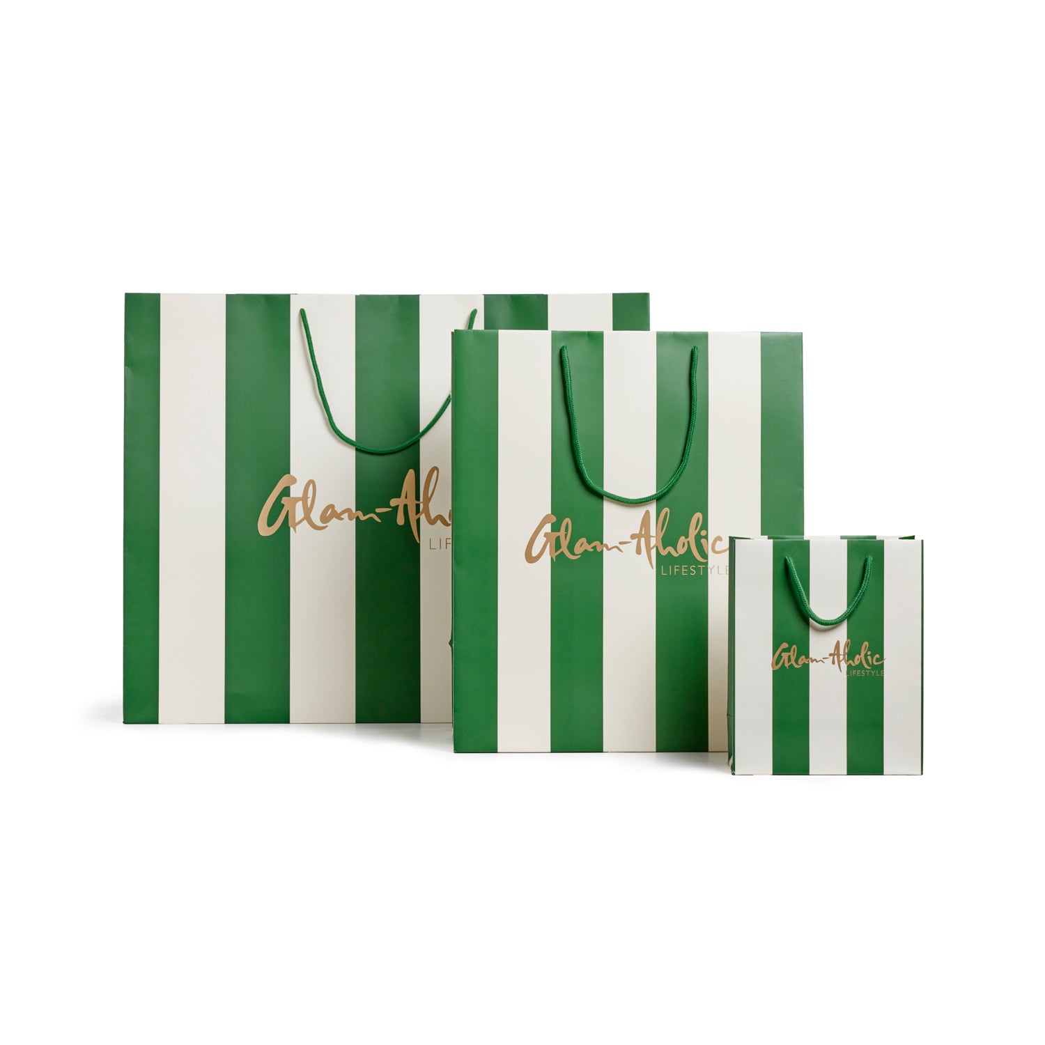 Green and cream striped gift bags in various sizes featuring the Glam-Aholic Lifestyle logo. Ideal for stylish gifting.
