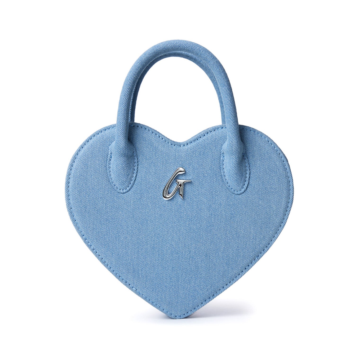 Blue denim heart-shaped bag with a small handle and a metallic "G" logo on the front.