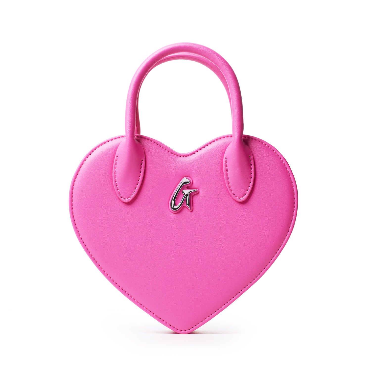 Pink heart-shaped bag with a silver "G" logo, featuring a top handle and stitched edges, stylish and playful accessory.