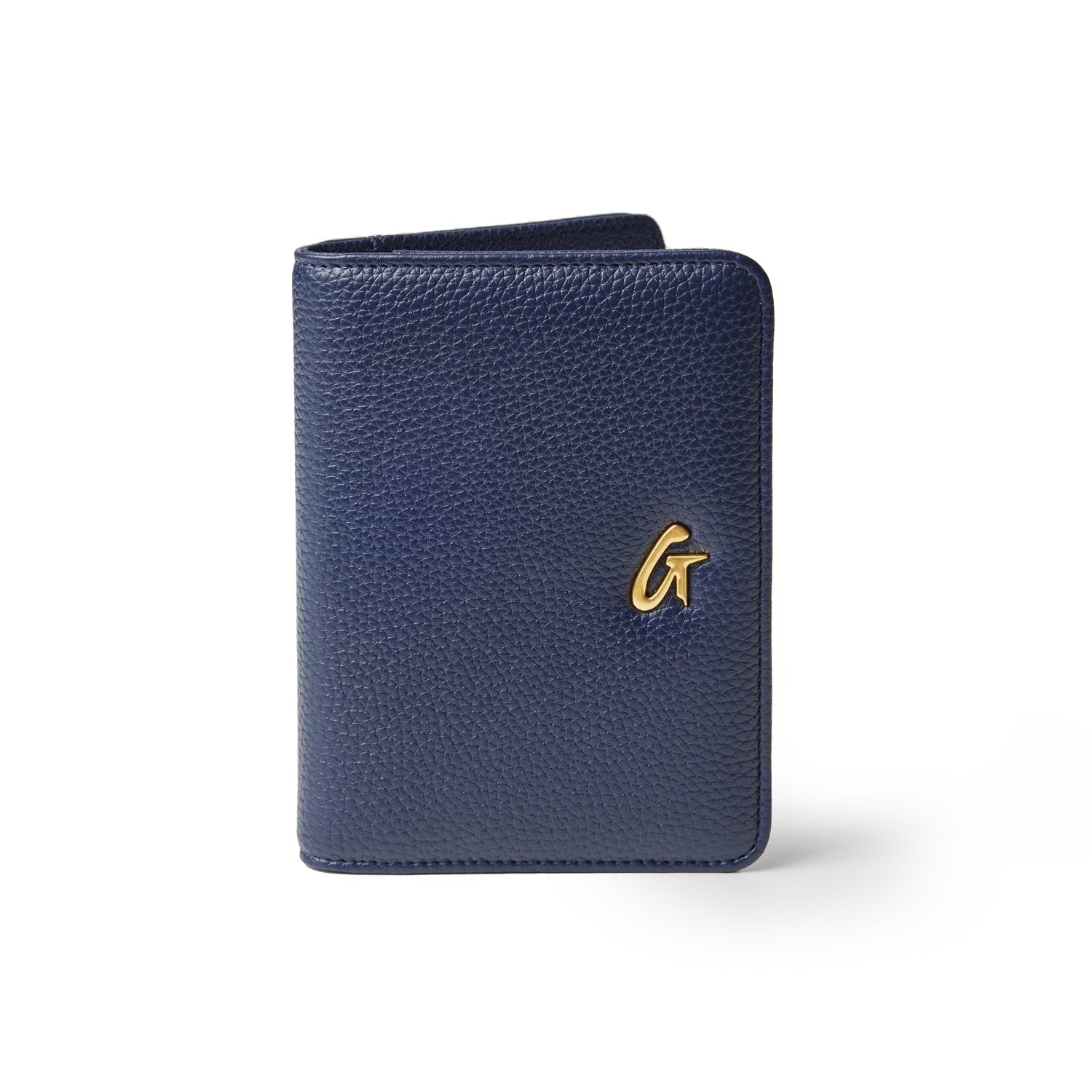 Navy Pebble Passport Holder with a gold logo, textured leather, compact design, and rounded edges.