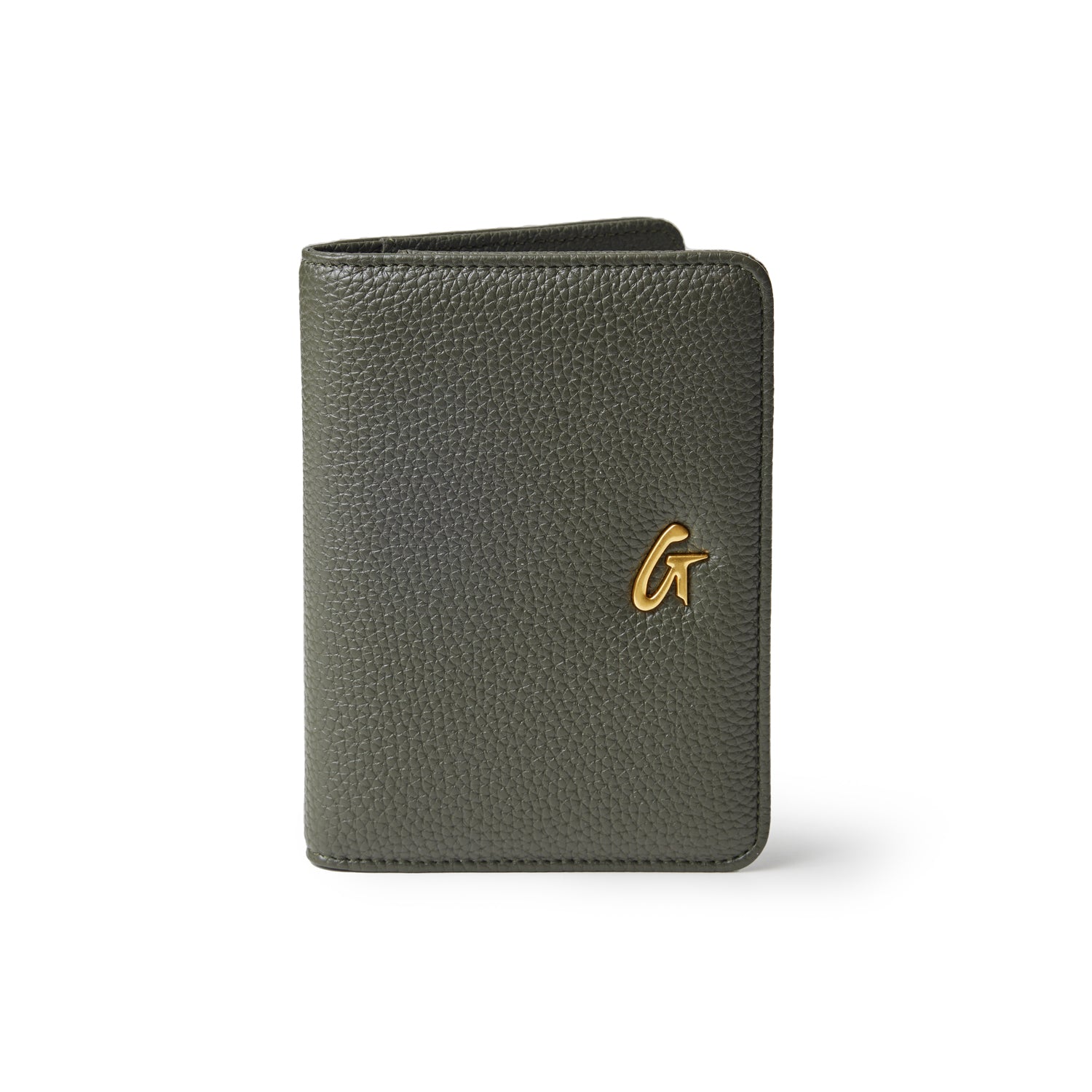Olive green Pebble passport holder with textured leather finish and a gold logo accent on the front.