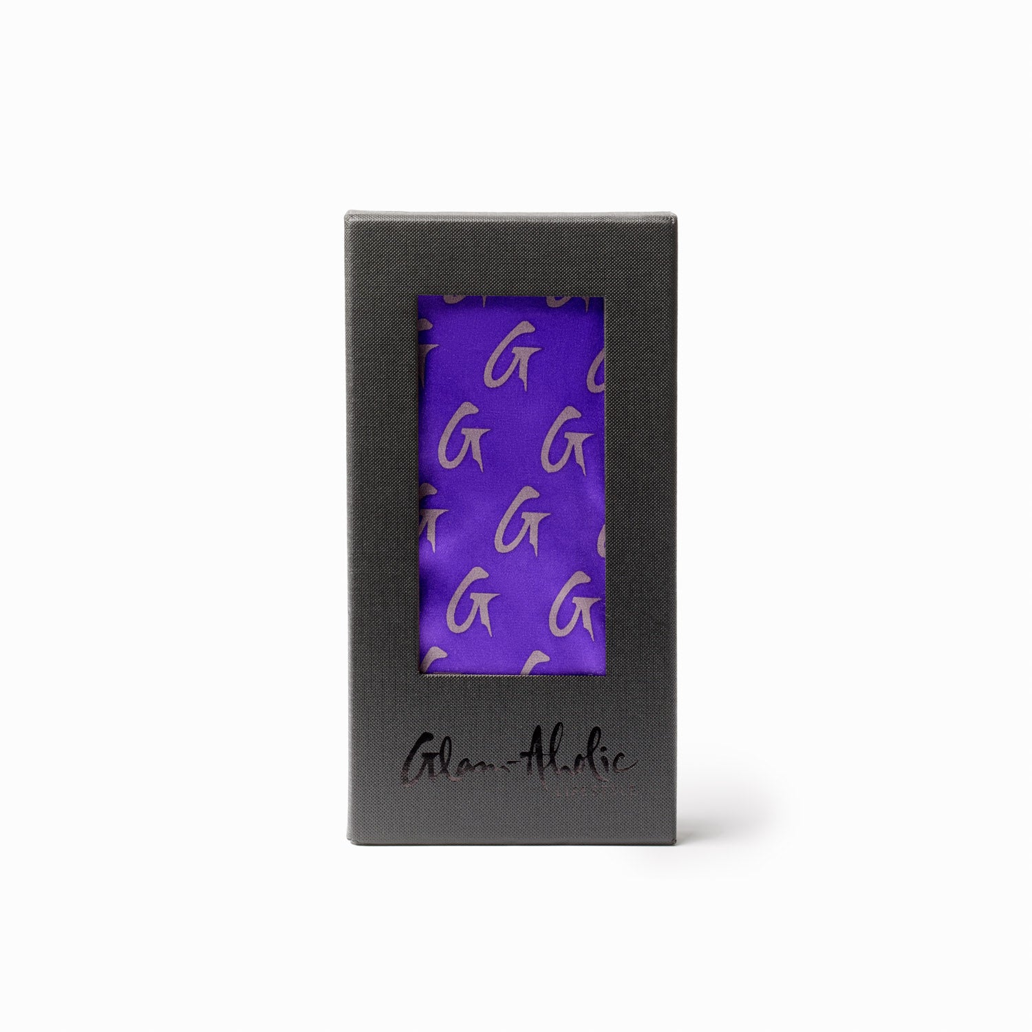 Medium purple silk scarf with a monogram pattern, packaged in a black box with a clear window.