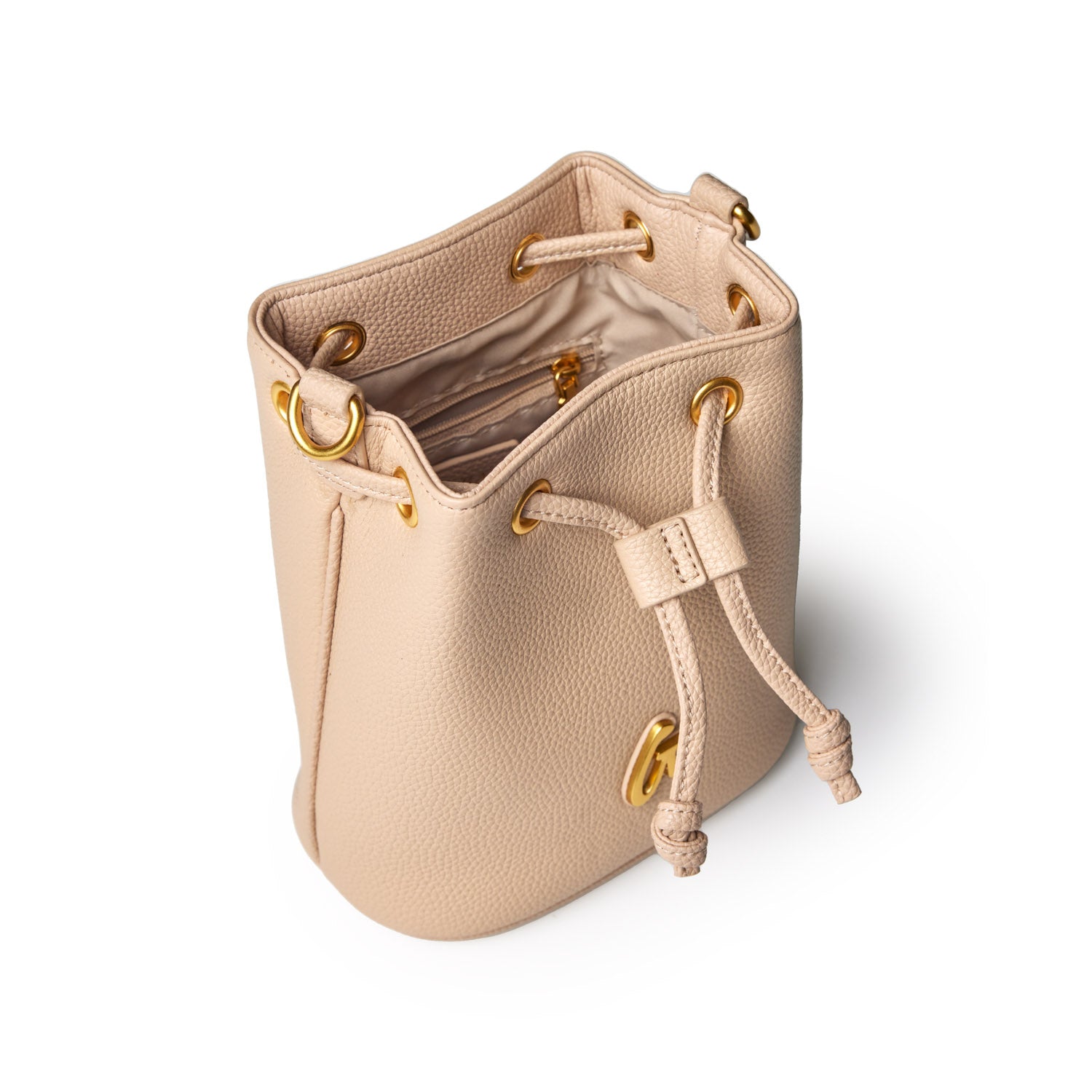 Mini pebble bucket bag in nude with gold hardware, drawstring closure, and interior zip pocket.
