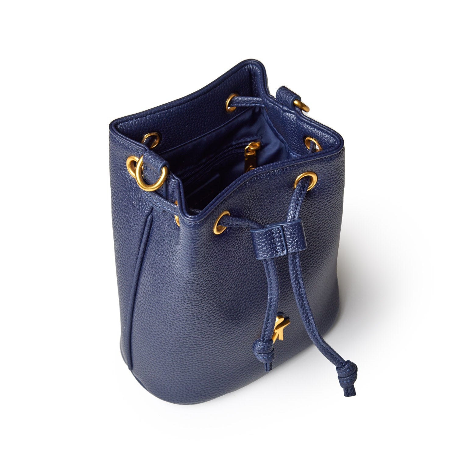 Mini pebble bucket bag in navy with gold-tone hardware, drawstring closure, and interior zip pocket.