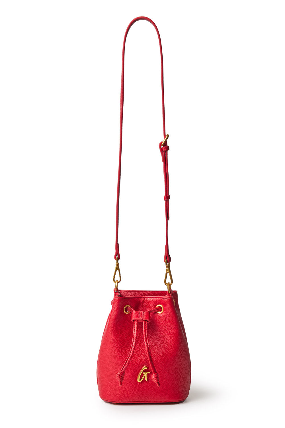 Red pebble-textured bucket bag with gold hardware, adjustable strap, and a decorative gold "G" charm.