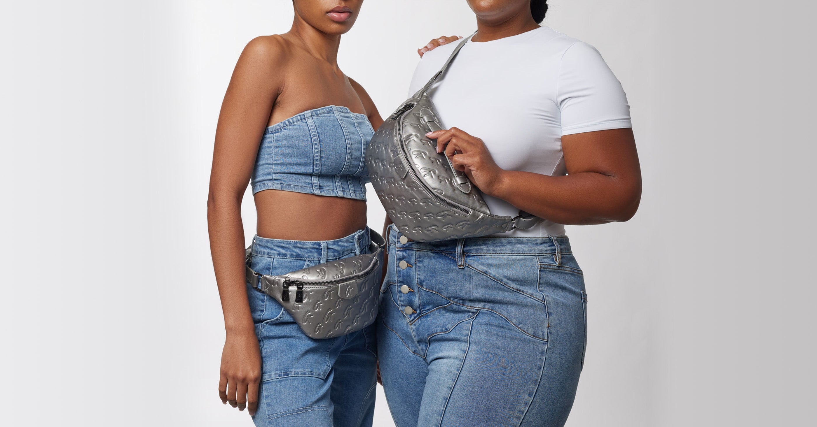 Women modeling silver designer-style handbags and accessories, casual denim outfits, against a light gray background.