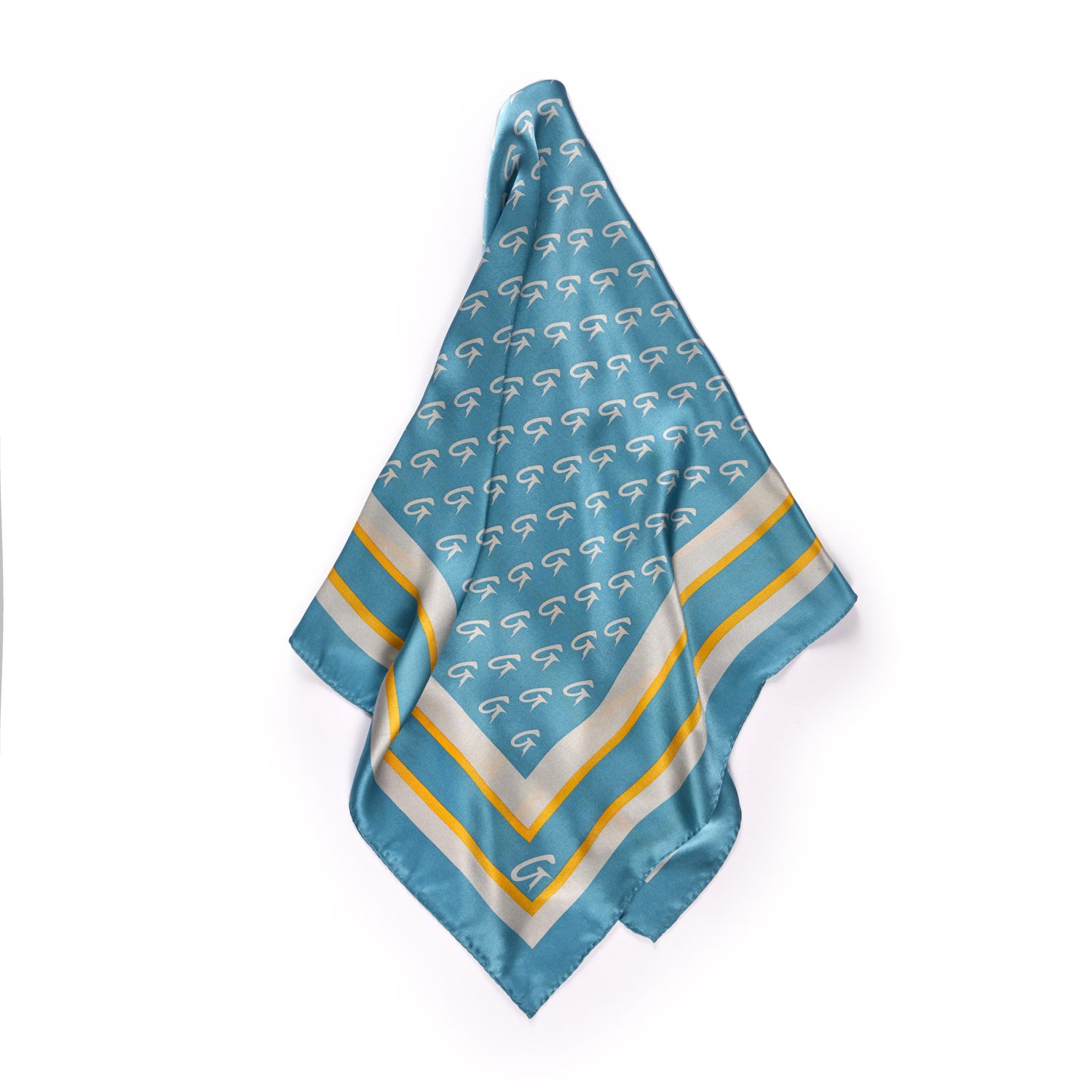Blue silk scarf with a large monogram pattern, gold and white border accents, and a luxurious, shiny finish.