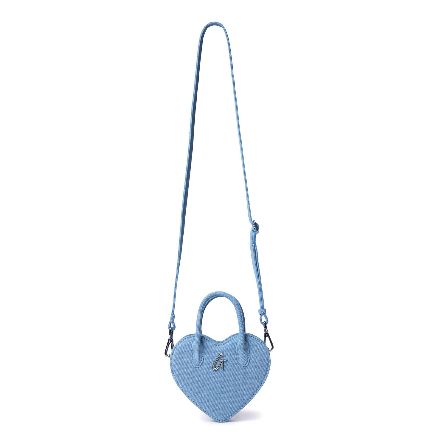 Mini denim heart-shaped bag with a top handle, adjustable shoulder strap, and a metallic "G" logo on the front.