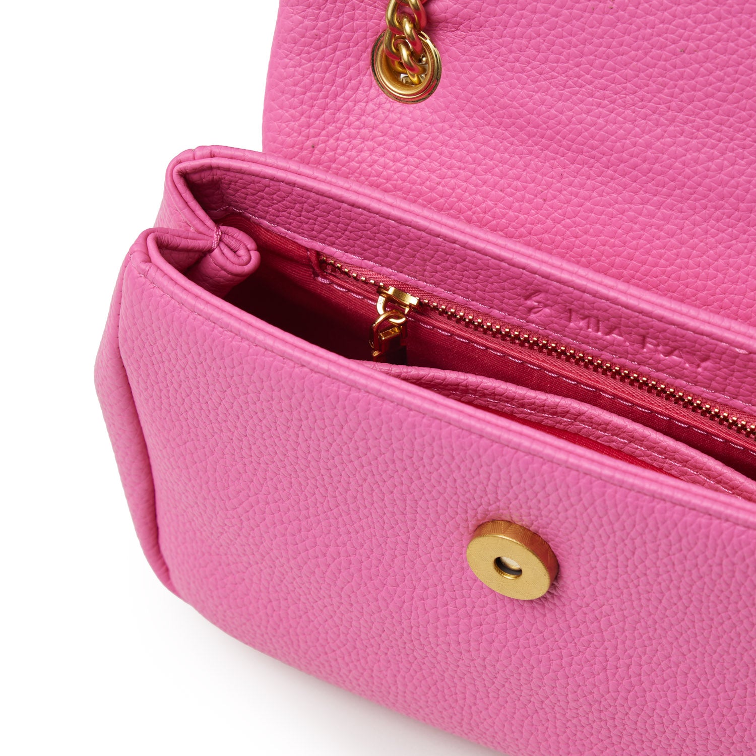 Mini pebble flap bag in hot pink with gold chain detail and interior zip pocket, featuring textured leather and gold hardware.