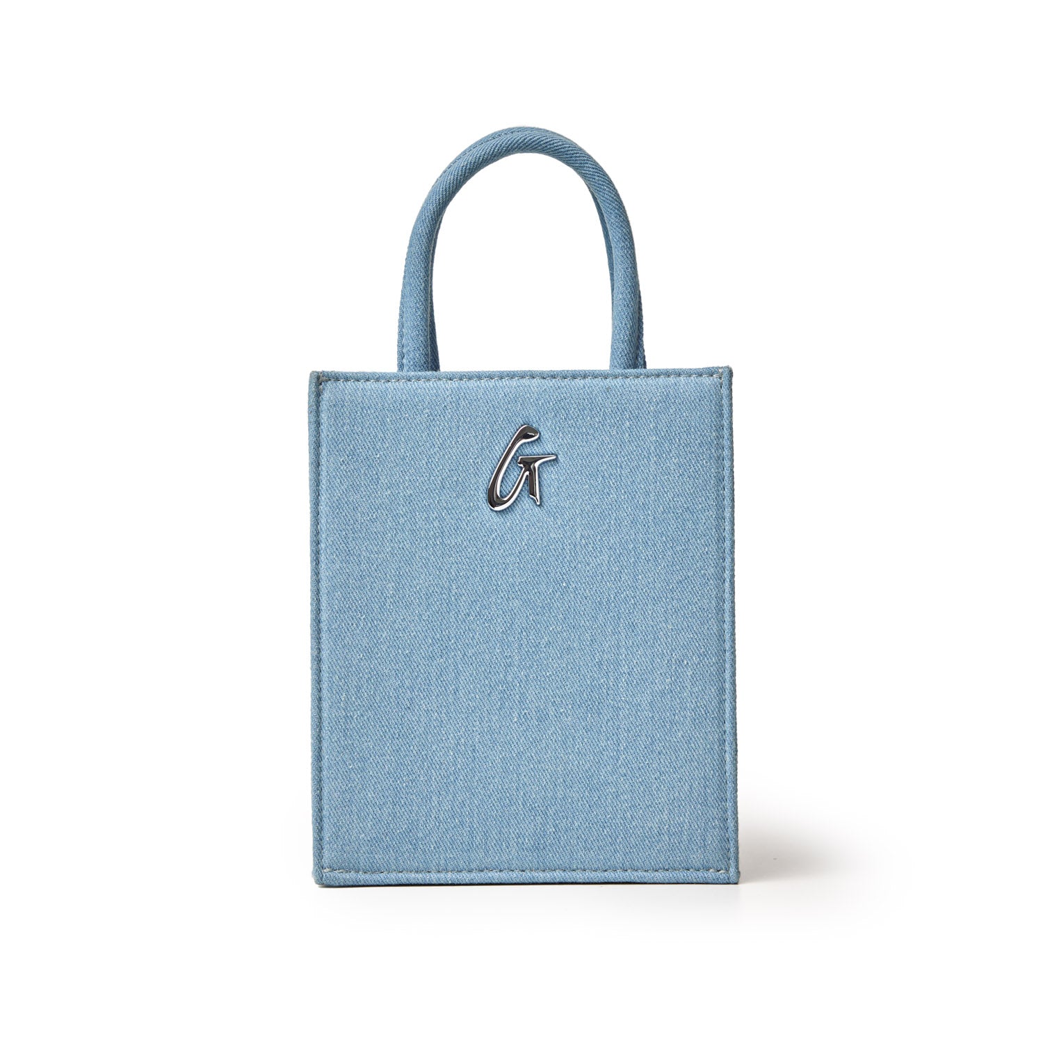 Mini denim silver tote bag with a small handle and a metallic "G" logo on the front, featuring a sleek, compact design.