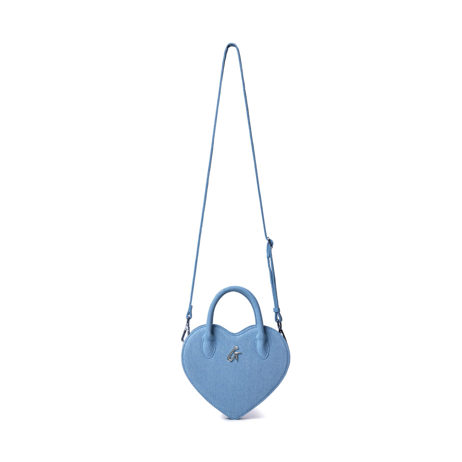 Blue denim heart-shaped bag with top handles, a silver "G" logo, and an adjustable shoulder strap.