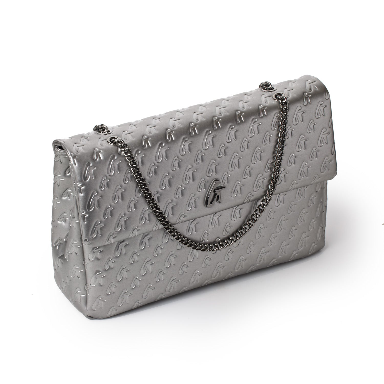 Large platinum-colored Monogram Flap Bag with embossed logo pattern and a silver chain strap.