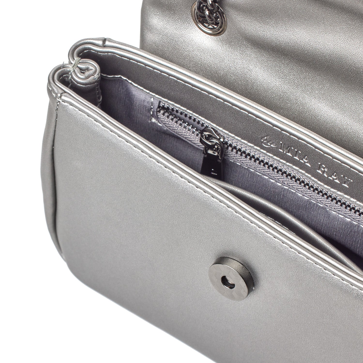 Close-up of a silver MINI STANDARD FLAP BAG in platinum with a front magnetic closure, interior zip pocket, and metallic finish.