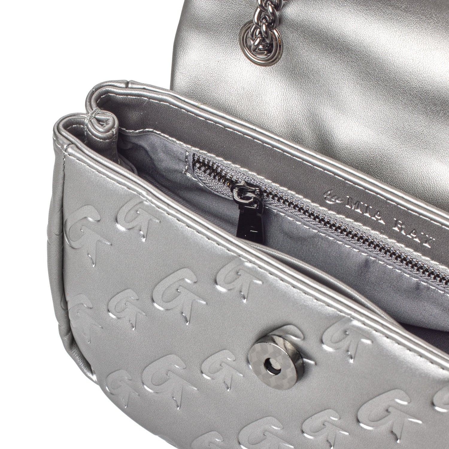 Close-up of a silver MINI Monogram Flap Bag in platinum, featuring embossed logo pattern, interior zip pocket, and chain strap.