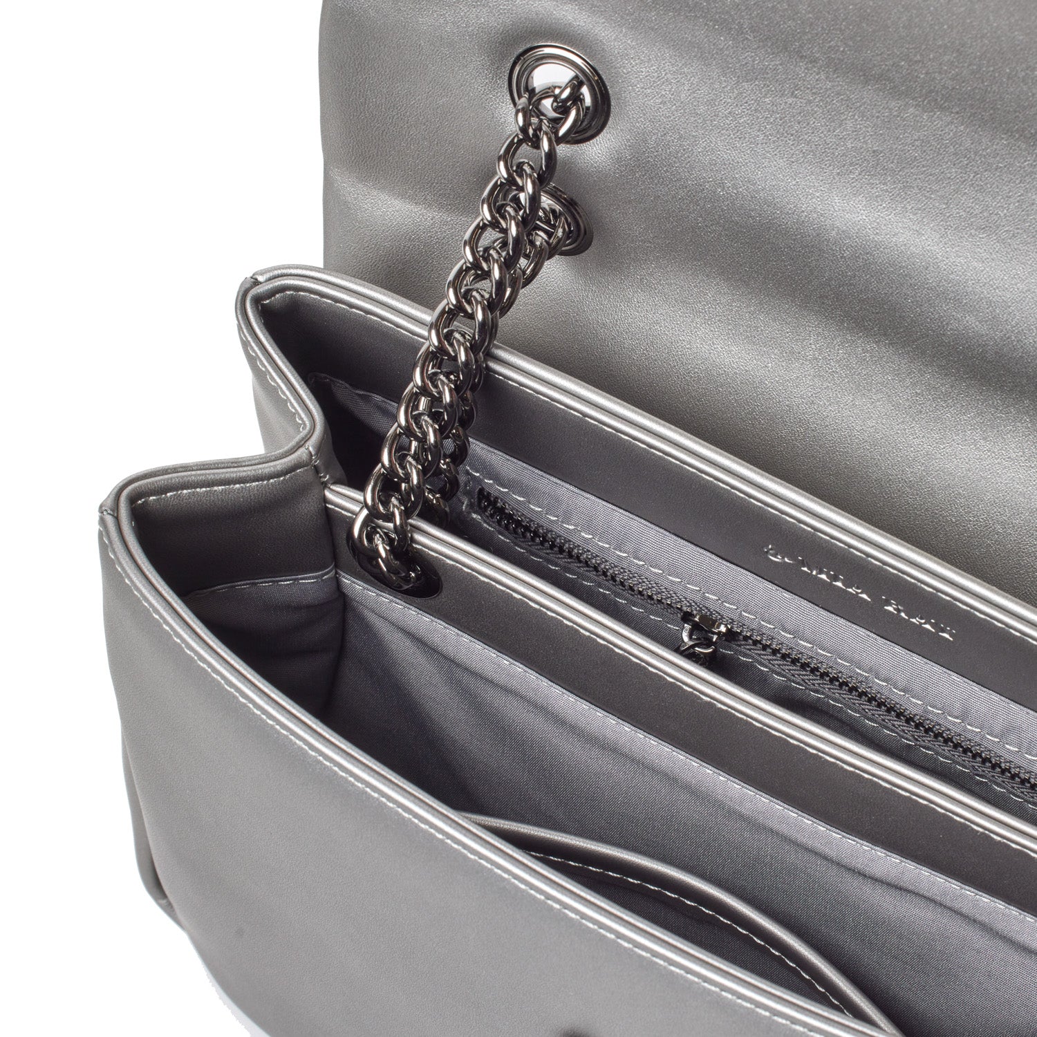 Medium platinum flap bag with chain strap, interior zip pocket, and sleek metallic finish.