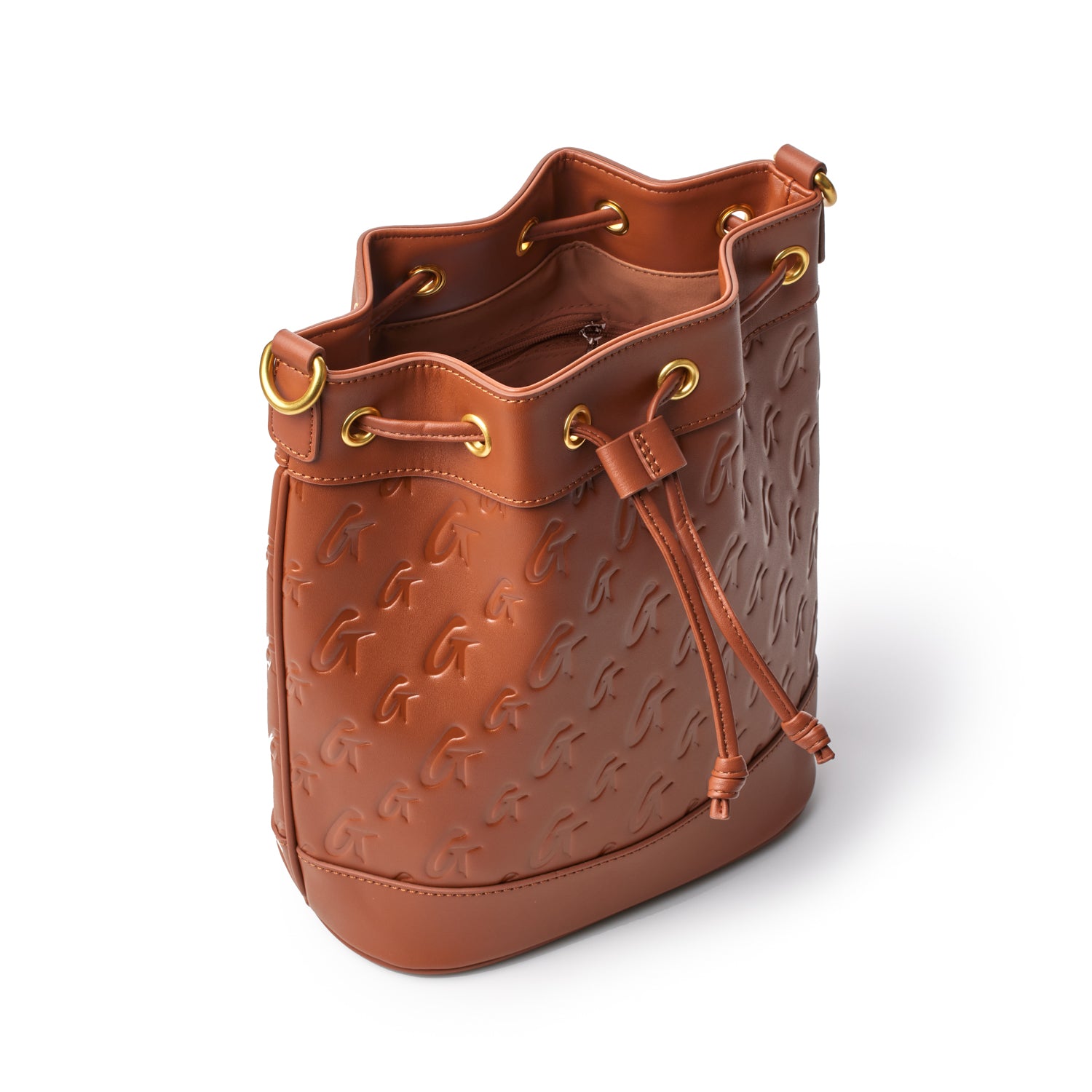 Brown medium monogram bucket bag with embossed logo pattern, gold-tone eyelets, drawstring closure, and interior zip pocket.
