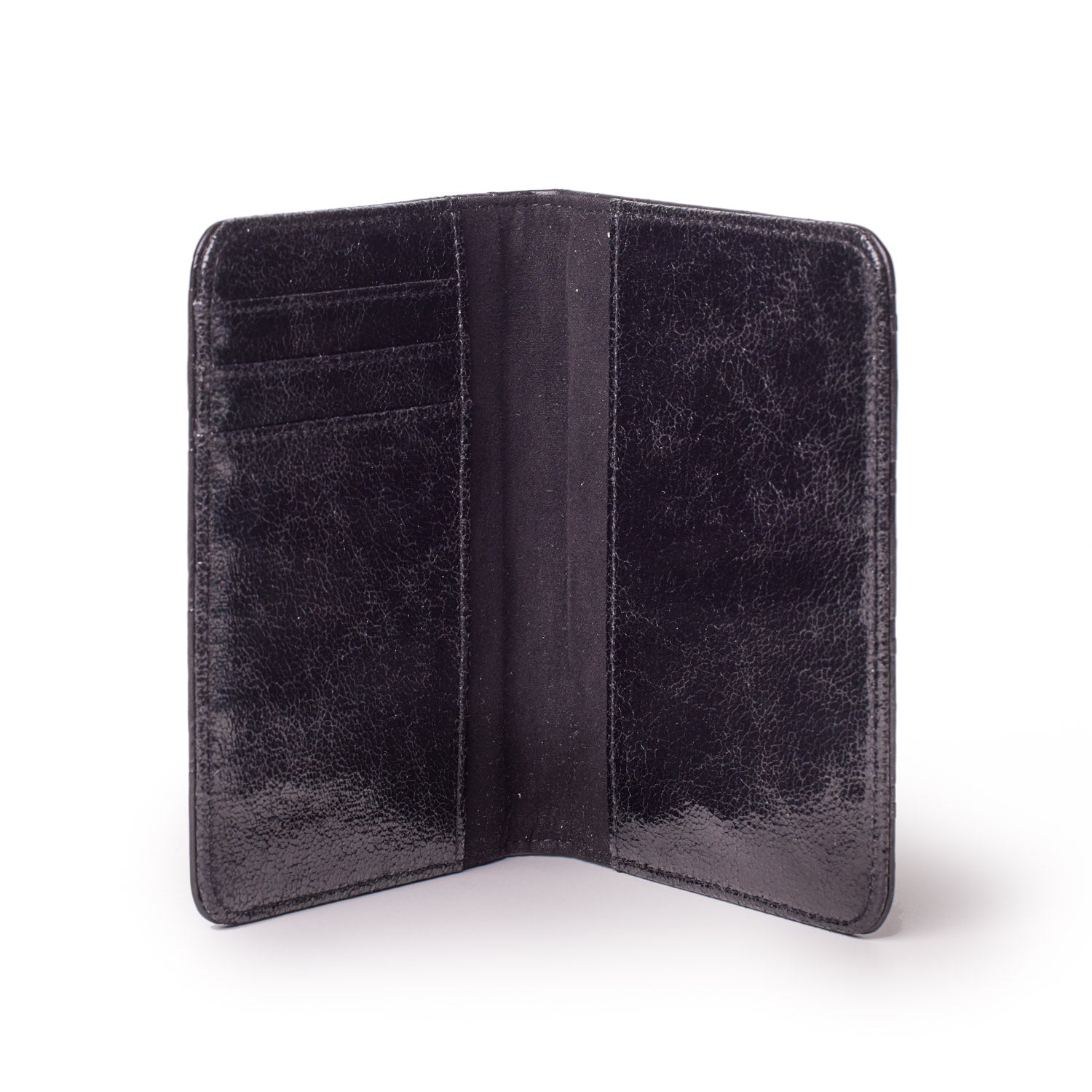 Black monogram passport holder with multiple card slots, open to show interior compartments.
