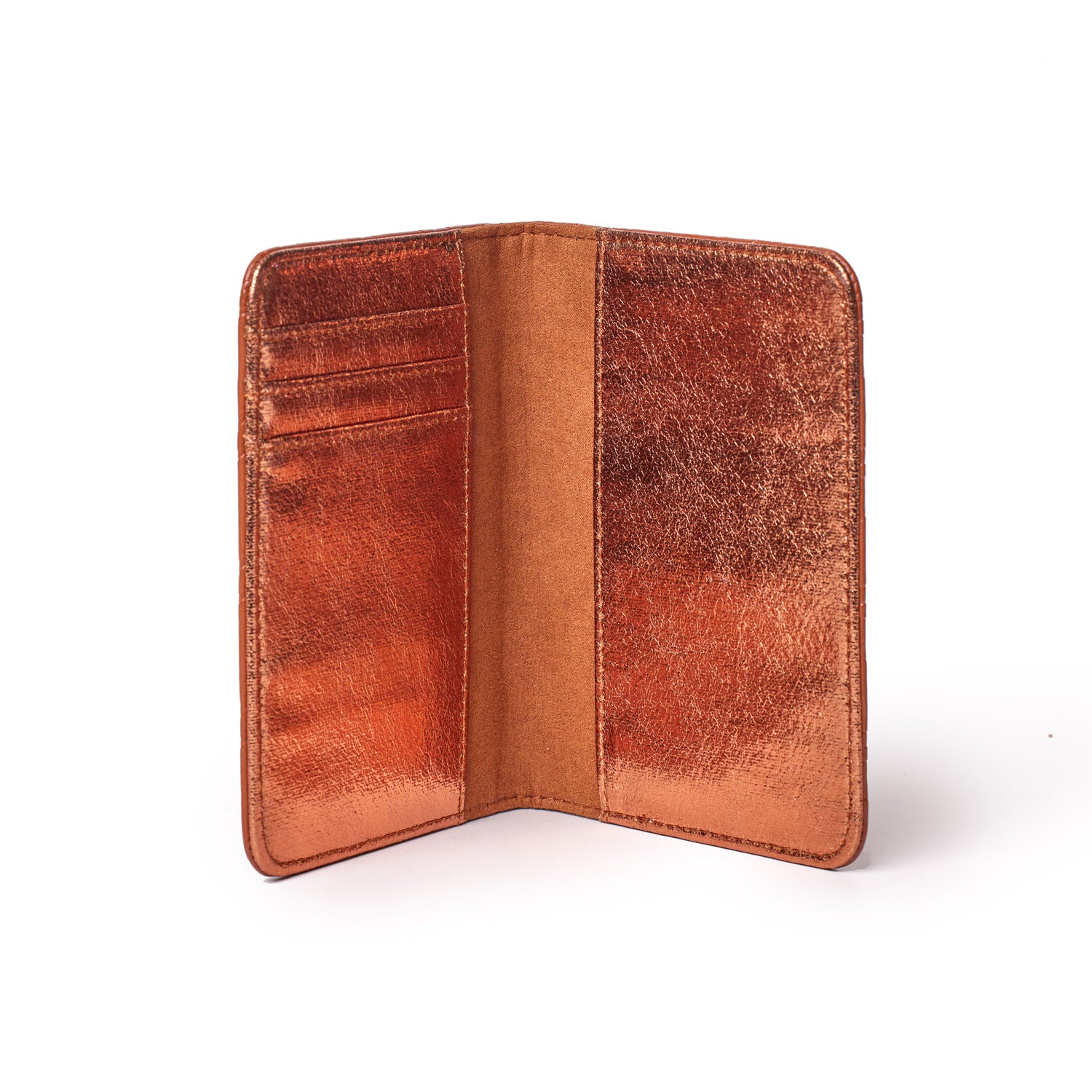 Brown monogram passport holder open, showing multiple card slots and a sleek, textured interior design.