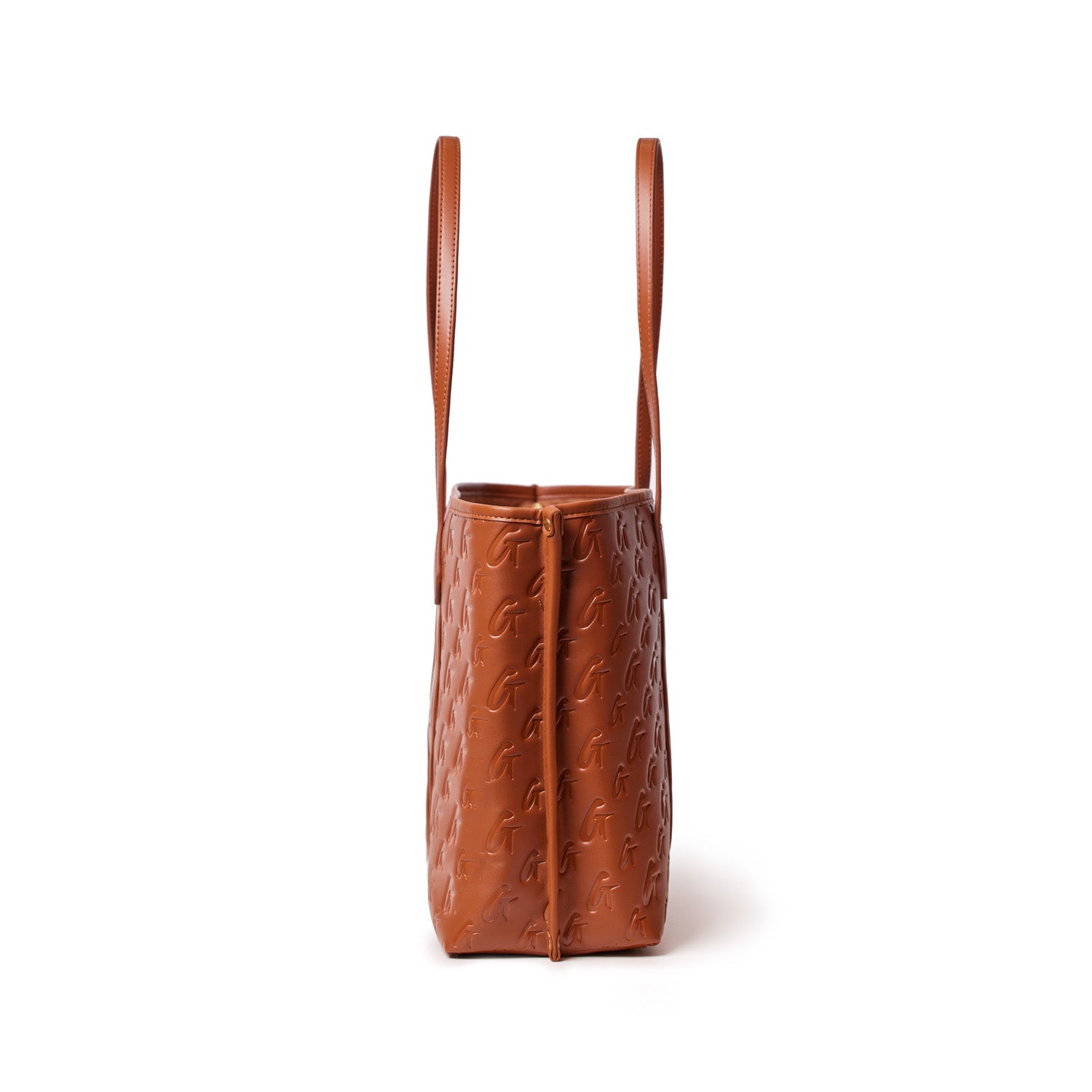 Brown Monogram Sleek Tote bag with embossed logo pattern and slim shoulder straps, stylish and spacious for everyday use.