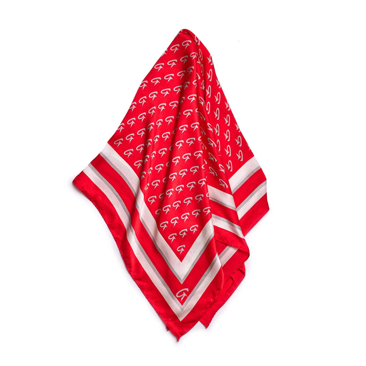 Red silk scarf with a large monogram pattern, featuring white and gray border stripes, styled in a classic square shape.