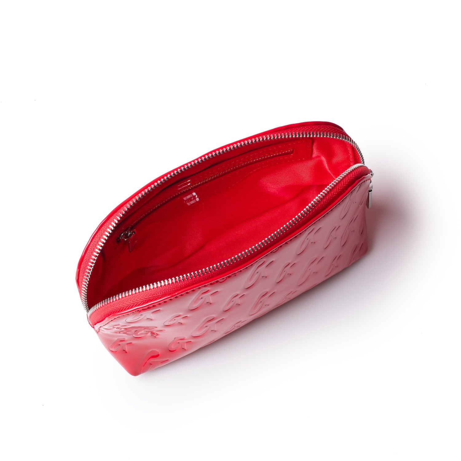 Red Monogram Cosmetic Pouch with a zipper closure, embossed with a repeating logo pattern, and a spacious interior.