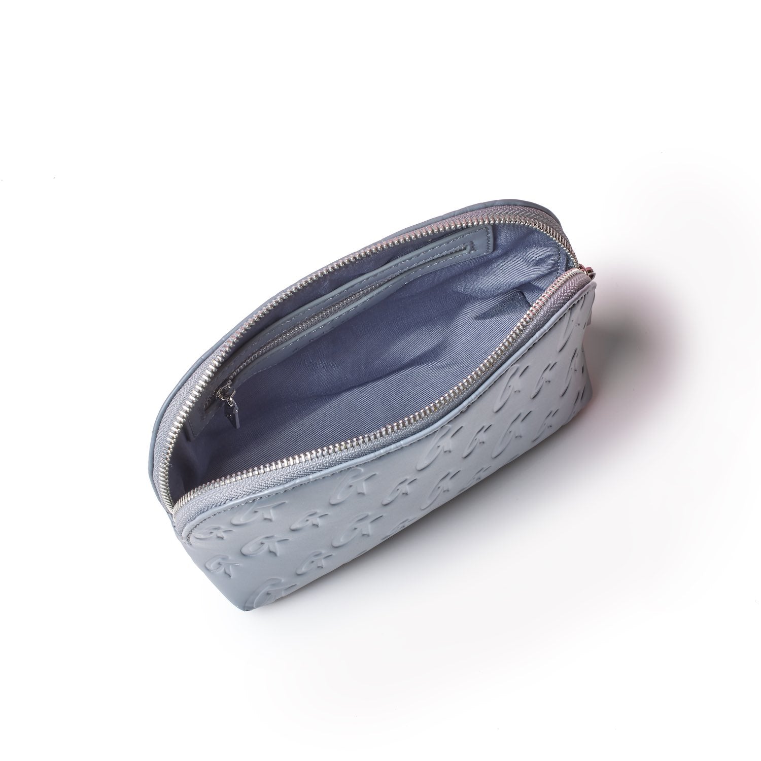 Gray monogram cosmetic pouch with embossed logo pattern, open zipper revealing a spacious interior with inner compartments.
