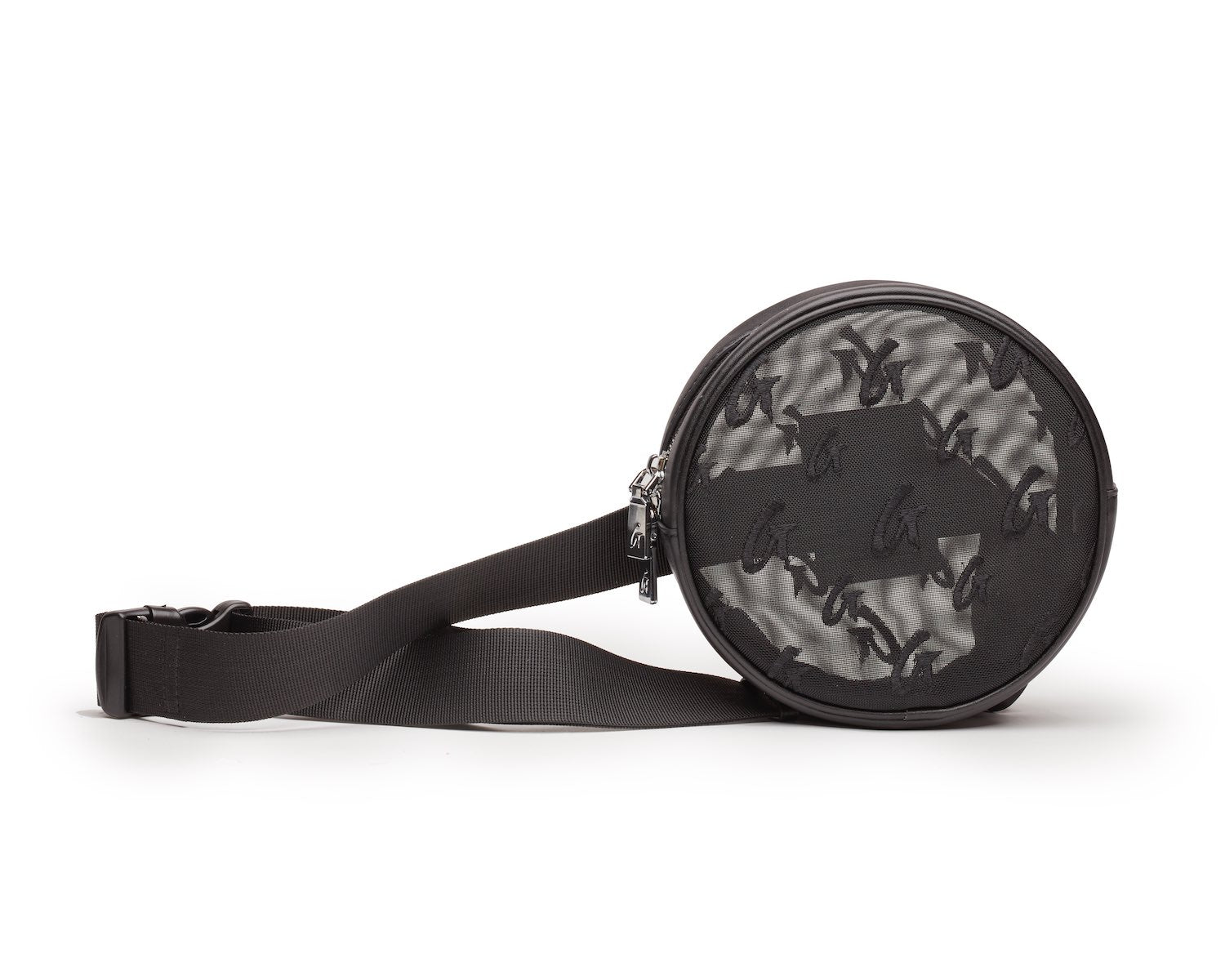 Black mesh monogram fanny pack with a round shape, adjustable strap, and a zippered front pocket.