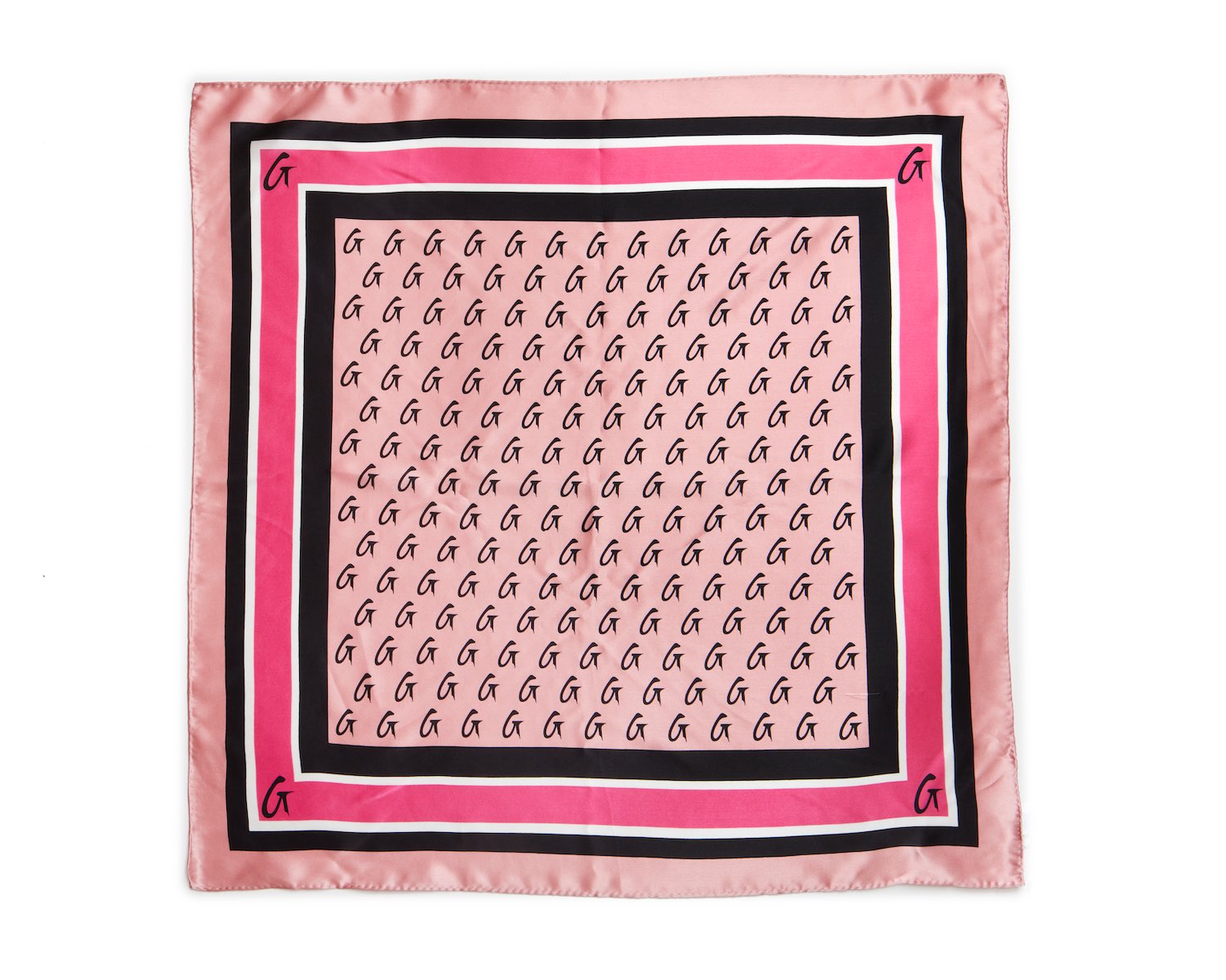 Pink silk scarf with a monogram pattern, featuring black and white borders and corner G initials.