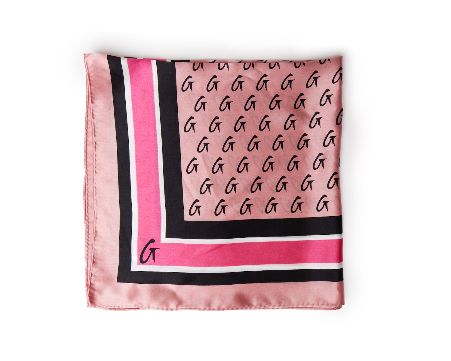 Pink silk scarf with a monogram pattern, featuring black, white, and pink borders and a small "G" logo.