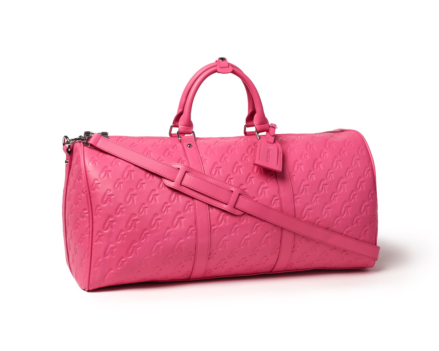 Hot pink Monogram duffle bag with embossed logo pattern, top handles, adjustable shoulder strap, and zipper closure.