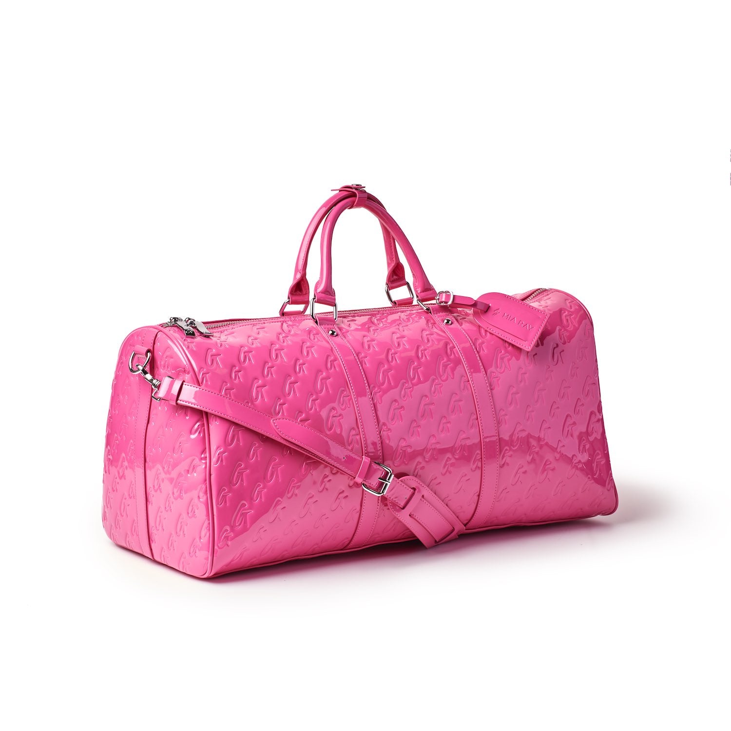 Pink Monogram Duffle Bag with embossed logo pattern, dual handles, adjustable shoulder strap, and silver hardware.