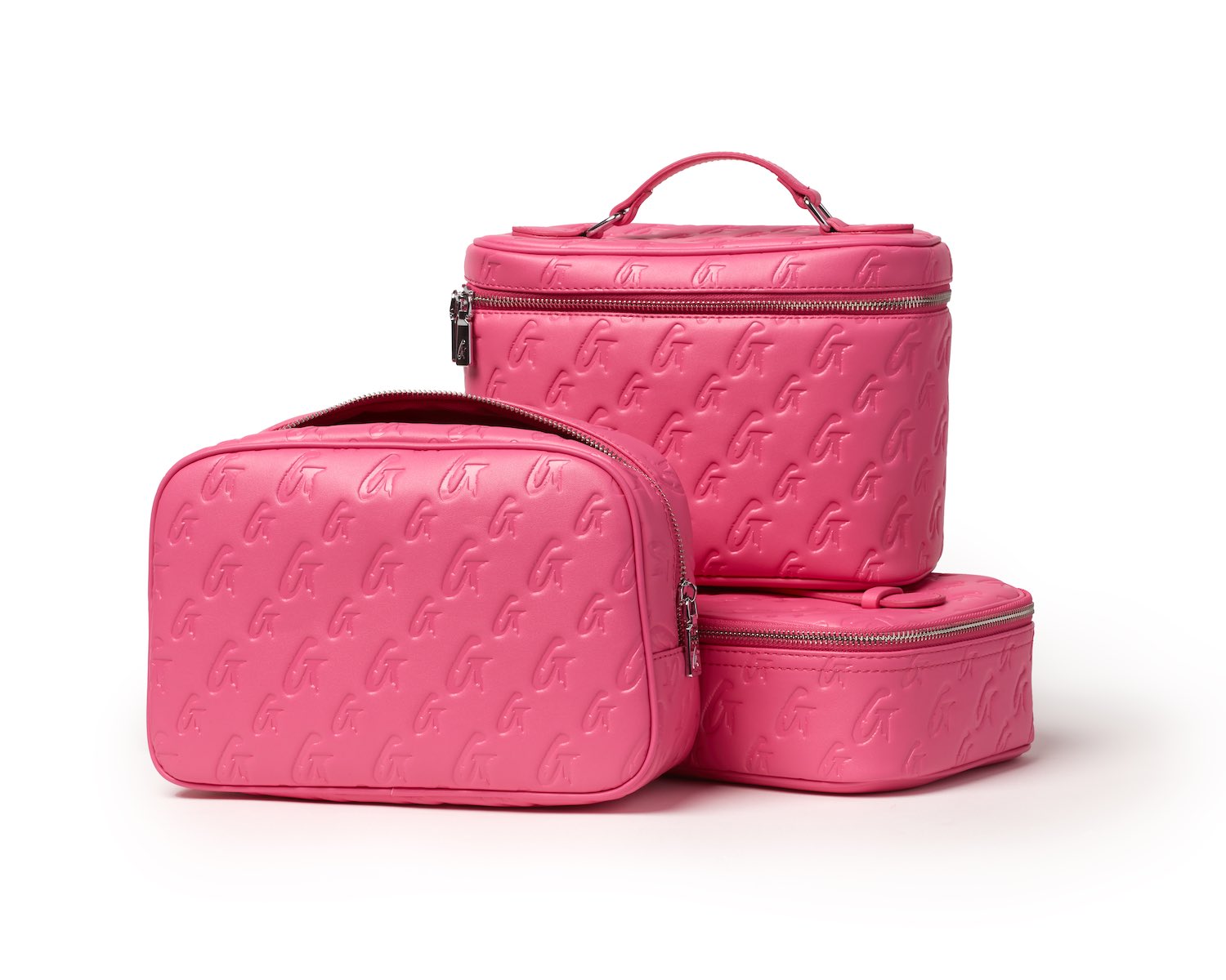 Set of three pink medium monogram toiletry bags with embossed G pattern, zippers, and a handle, ideal for travel organization.