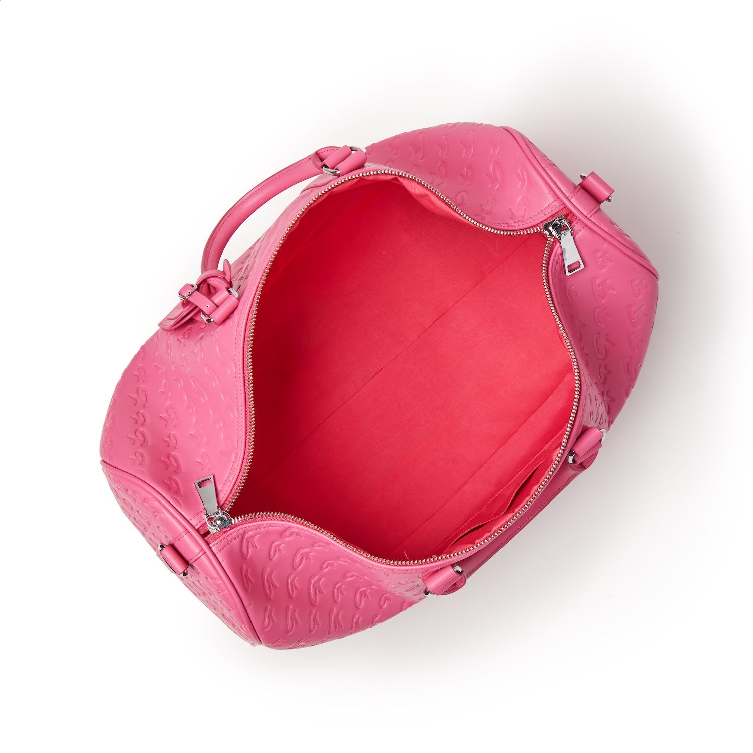 Open hot pink monogram duffle bag with embossed pattern, silver zipper, and pink handles, showing spacious interior.