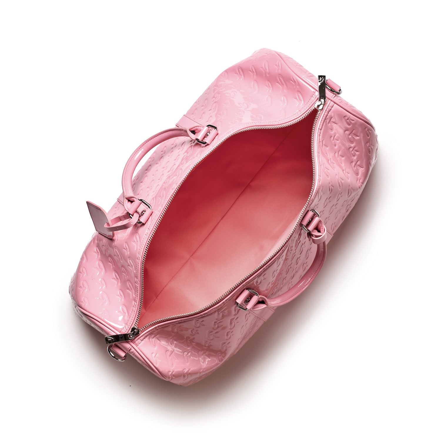 Pink mirror-finish monogram duffle bag with embossed logo pattern, top handles, and silver hardware, open to show spacious interior.