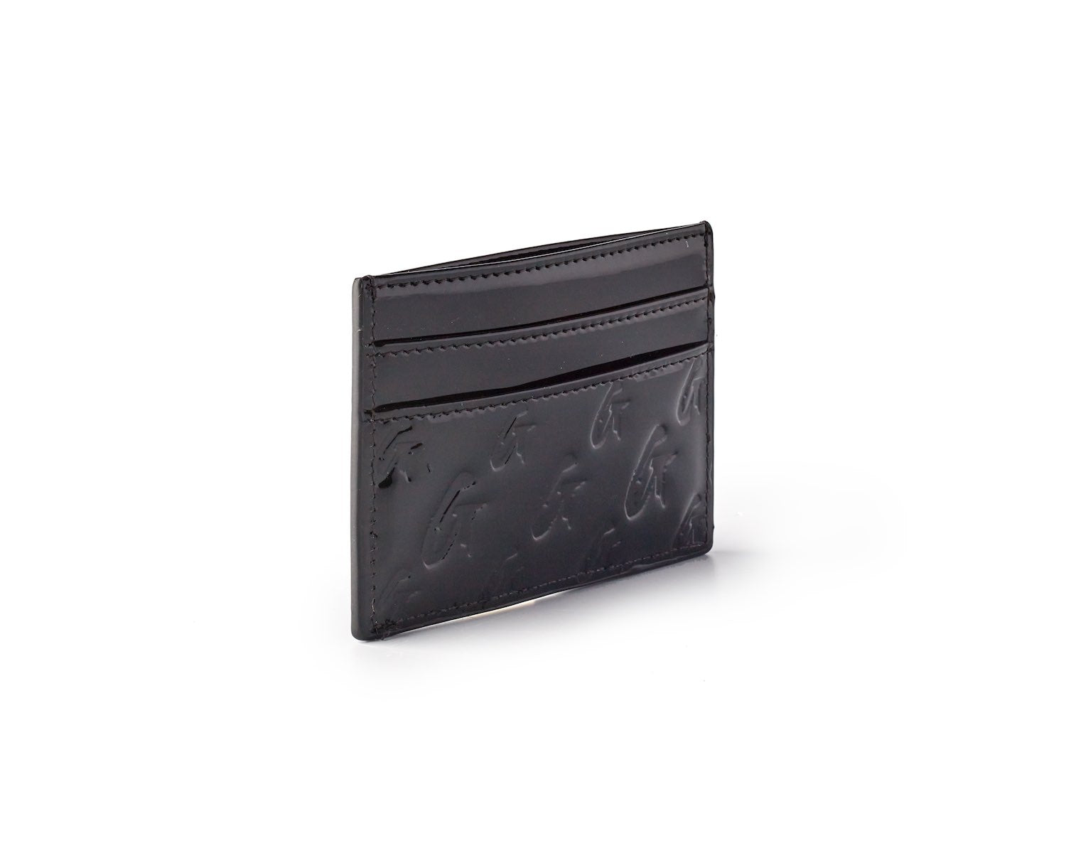 Black matte monogram card holder with embossed logo and three card slots, sleek and compact for everyday use.
