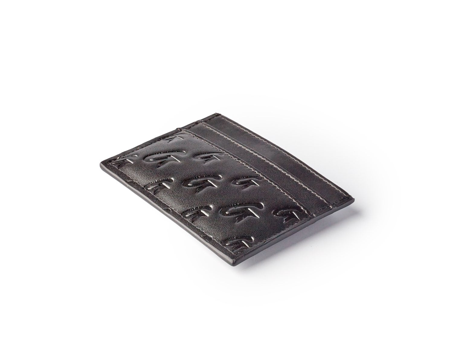 Black matte monogram card holder with embossed logo pattern and sleek design, perfect for organizing credit cards and IDs.